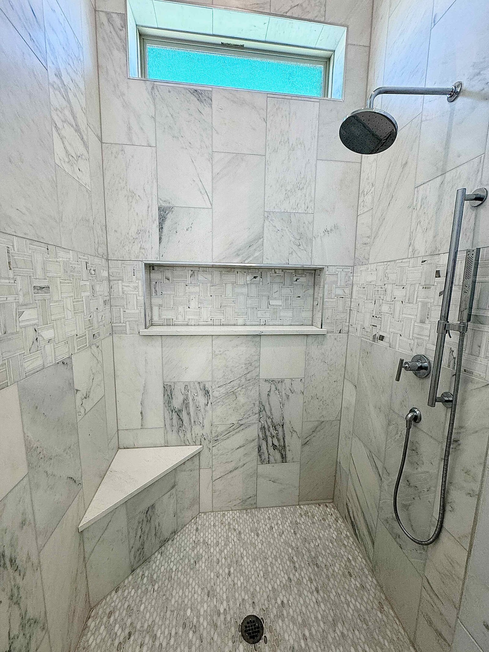Bathroom renovation design featuring modern fixtures, sleek tiles, and a sophisticated layout, creating a luxurious and functional space with a fresh, clean look.