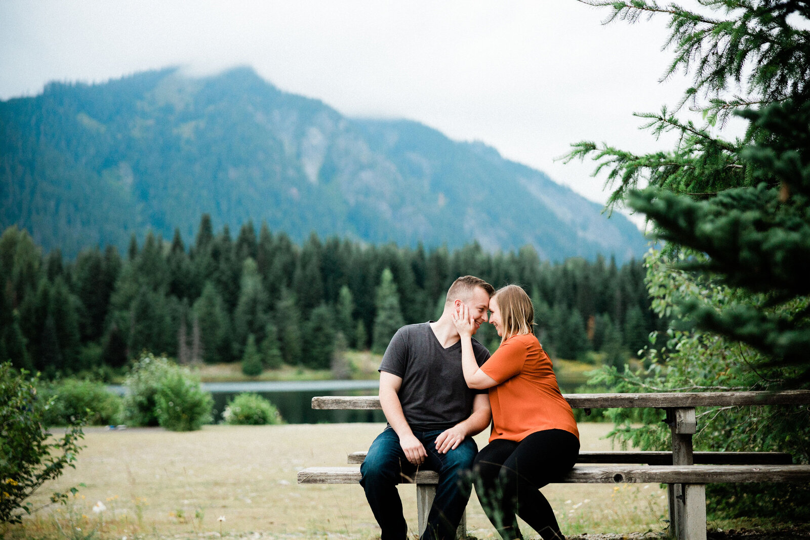 Couple kissing at romantic engagement photo spots near seattle