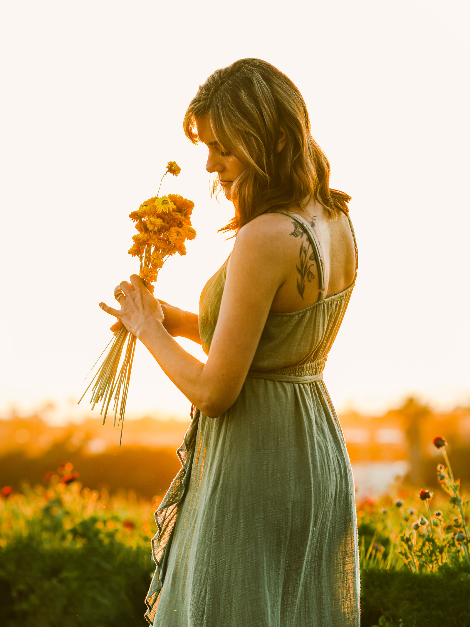 girl at flower fields in teal dress