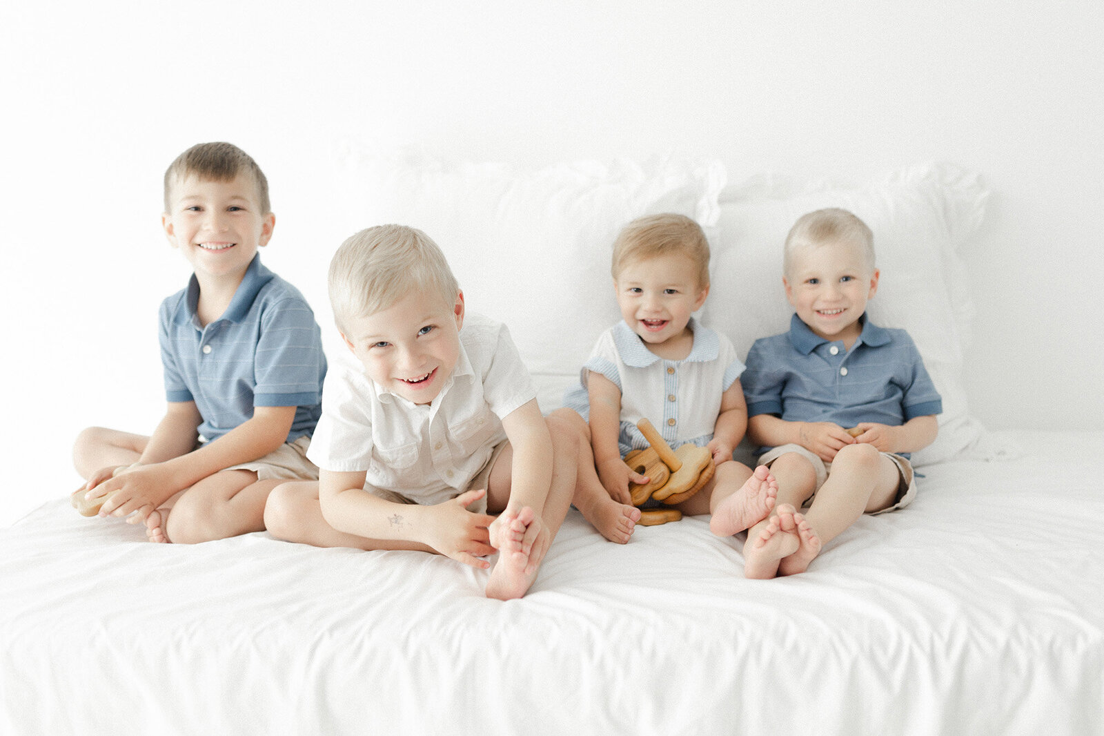 Children playing together during a Grand Forks family photo session