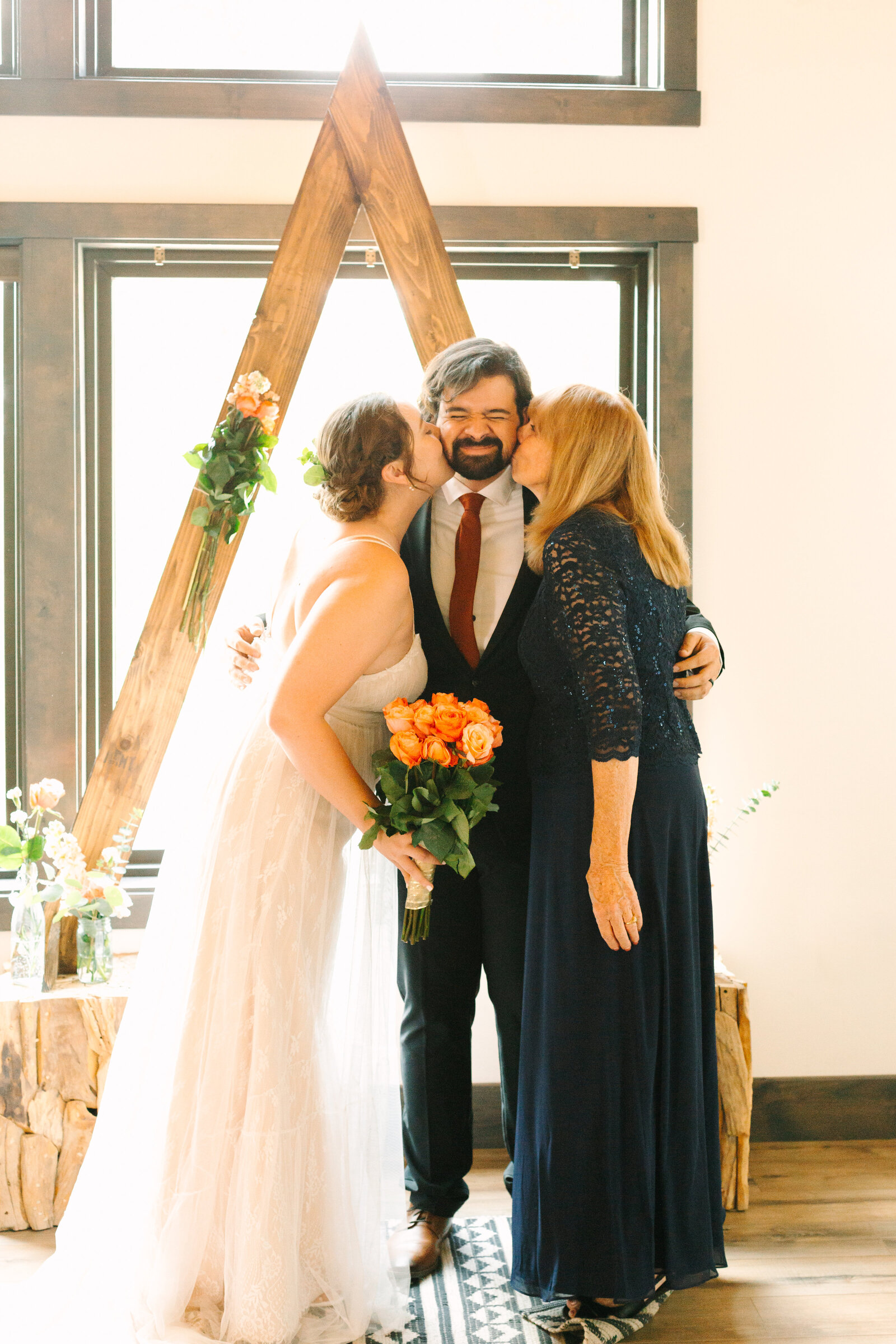 The bridal party celebrates an intimate elopement at a cabin at Big Bear Lake, California.