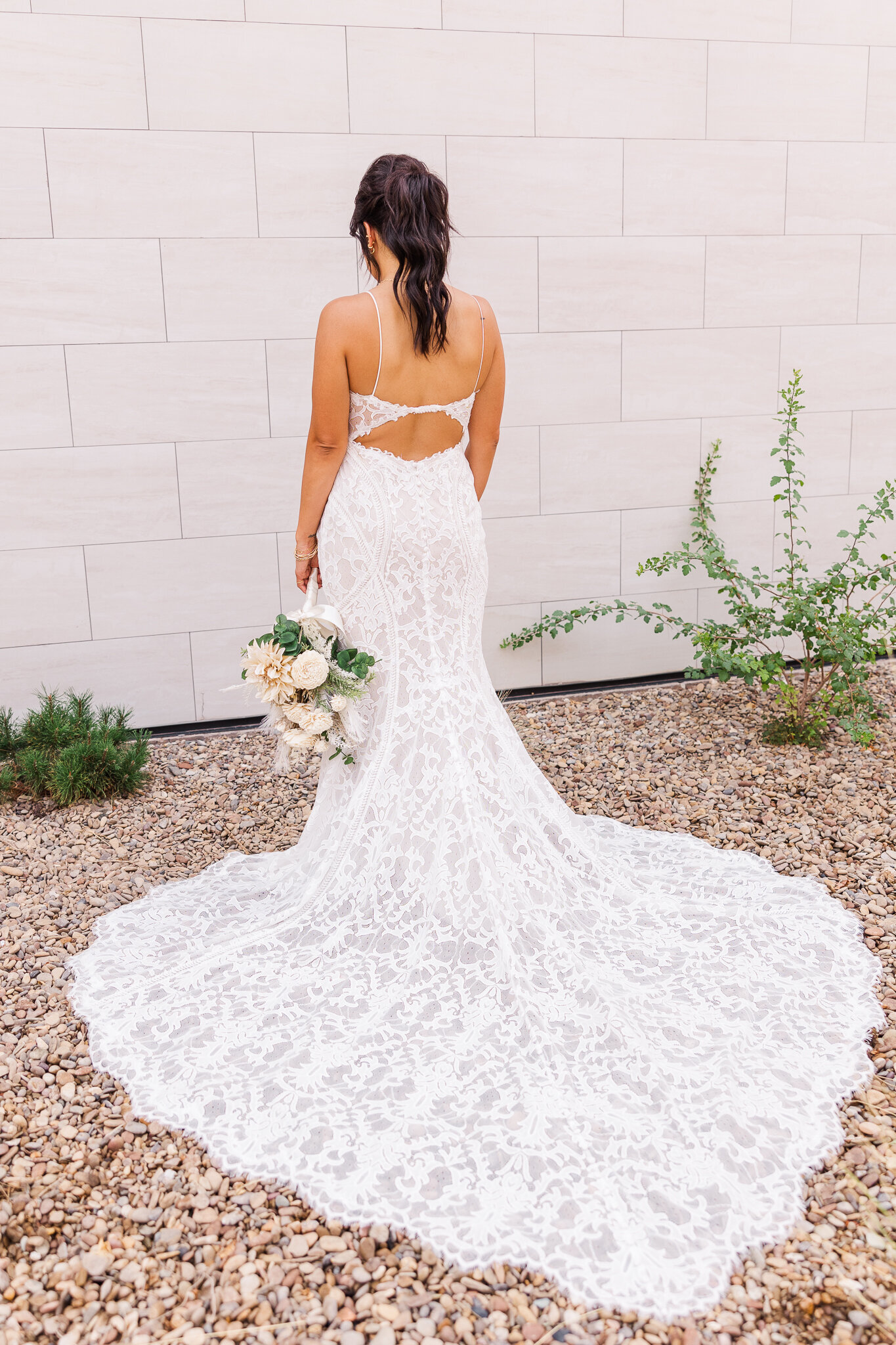 Back of bride in her white wedding gown at the Red Earth Venue 