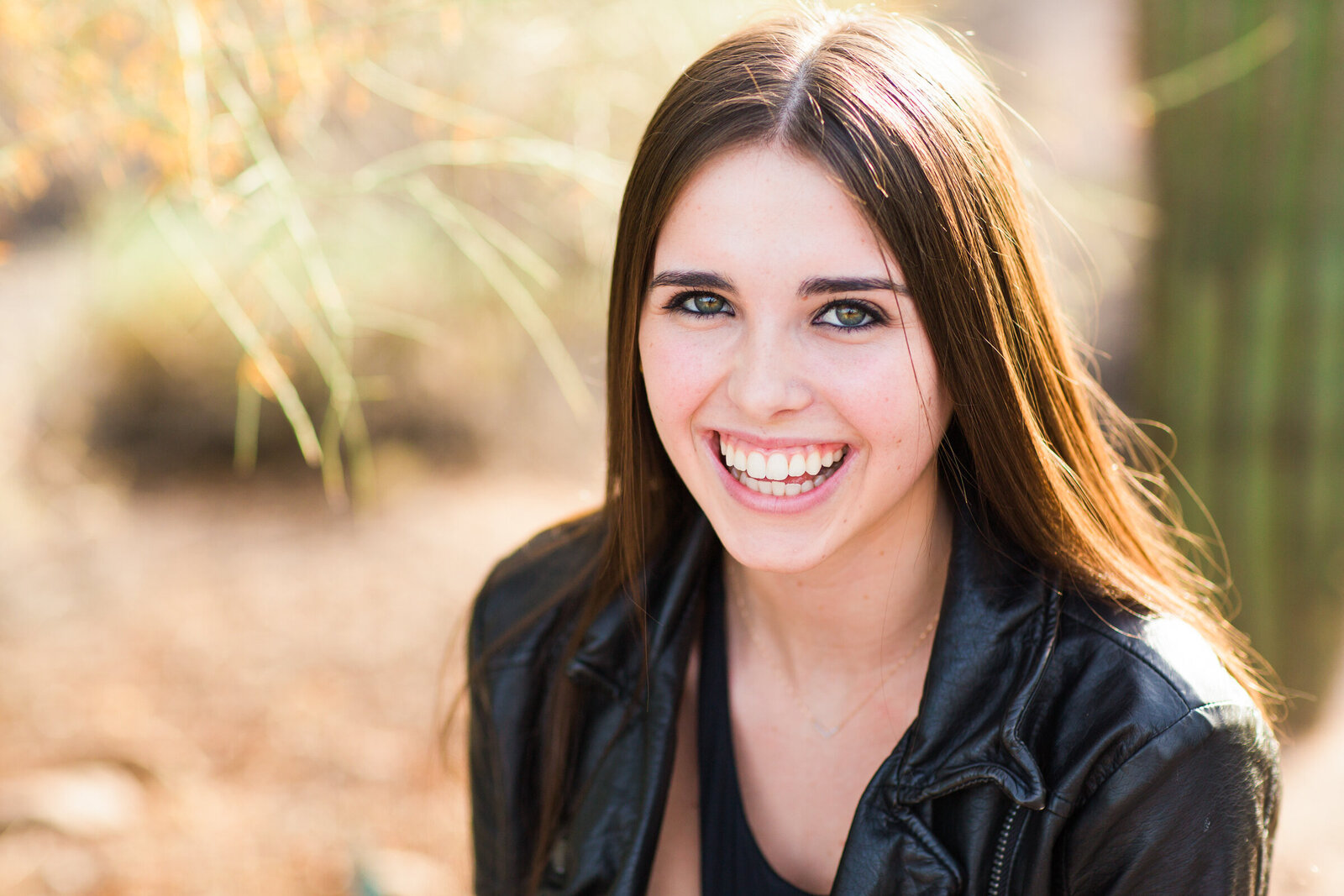 high school senior girl poses for senior photography session