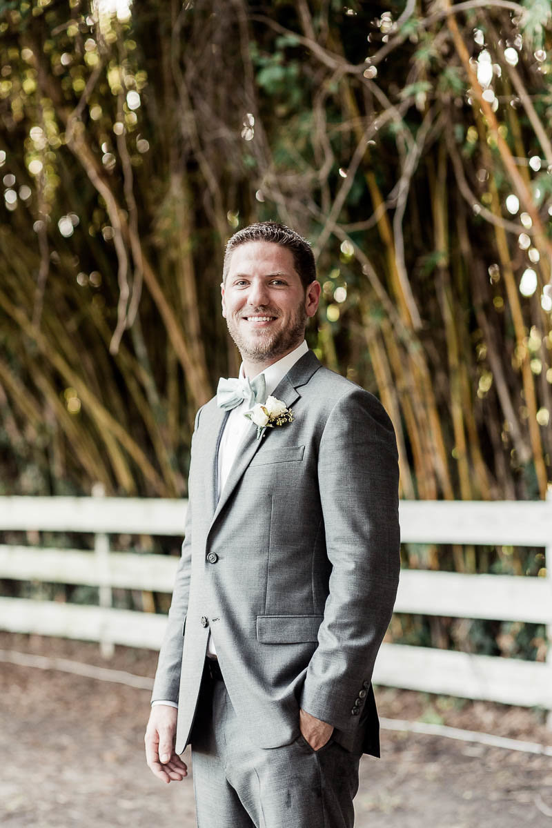 Groom stands by bamboo, Alhambra Hall, Mt Pleasant, South Carolina