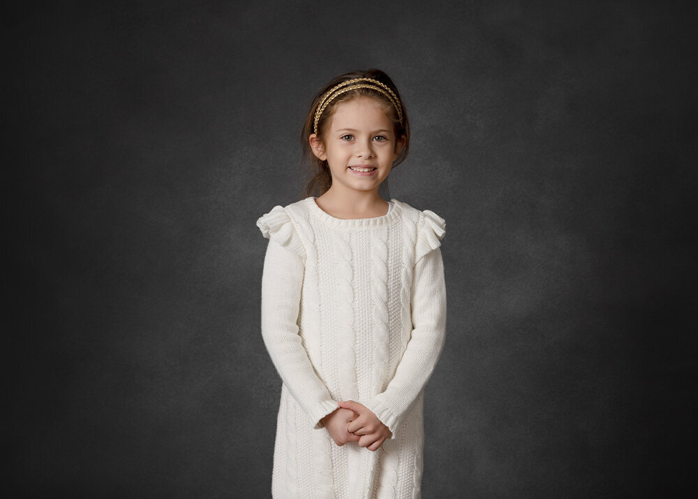 young-girl-in-portrait-studio-on-dark-background