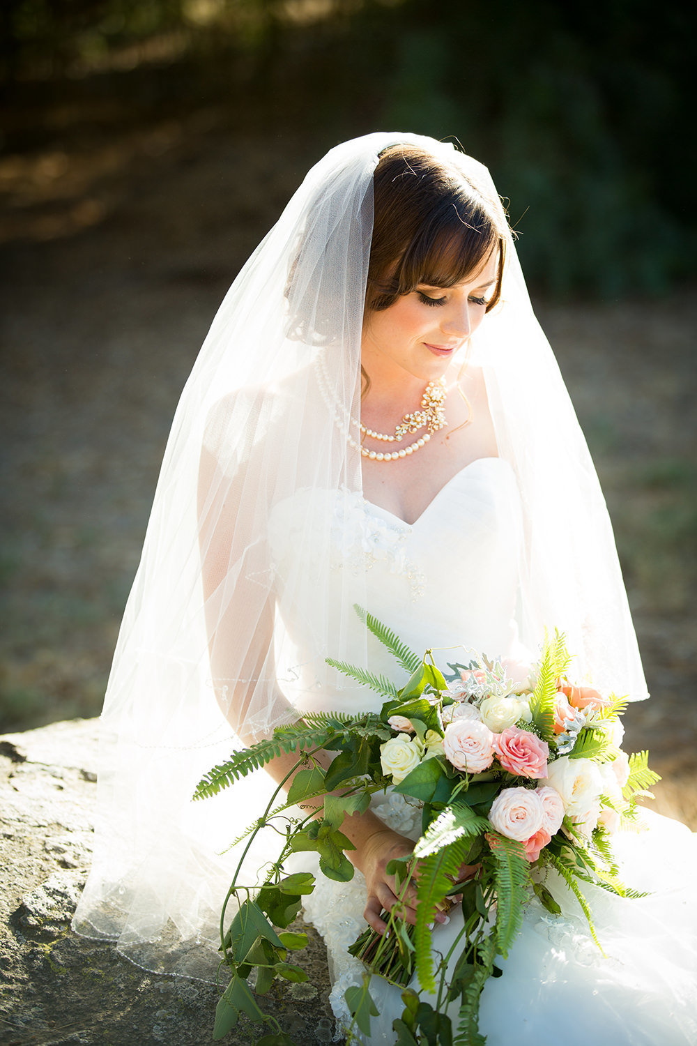 bride with white and pink bouquet