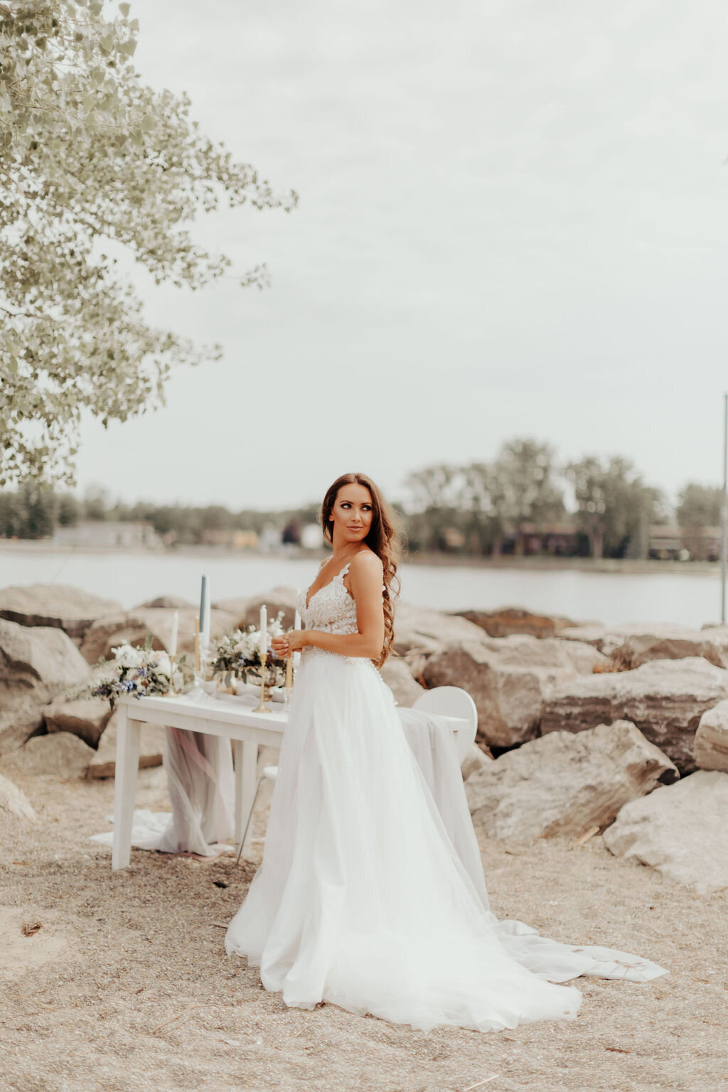 Bride in boho gown on beach