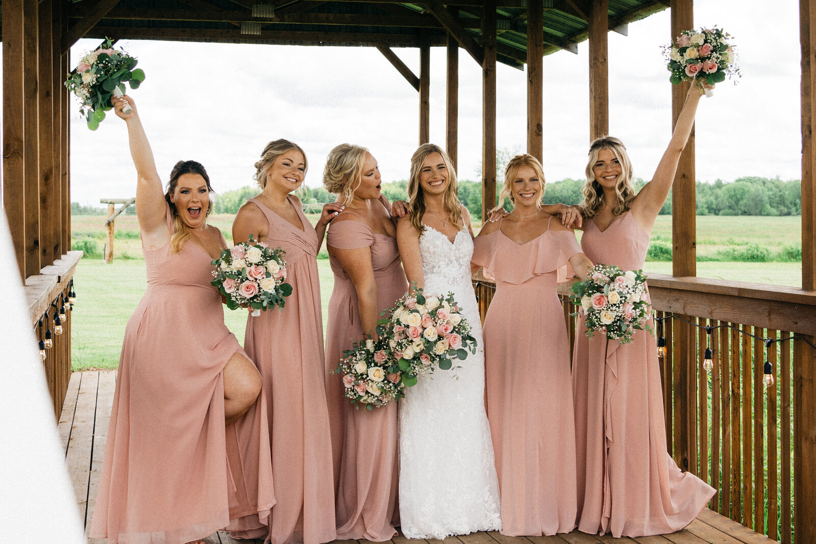 Luxury wedding photographer captures bridal party having fun