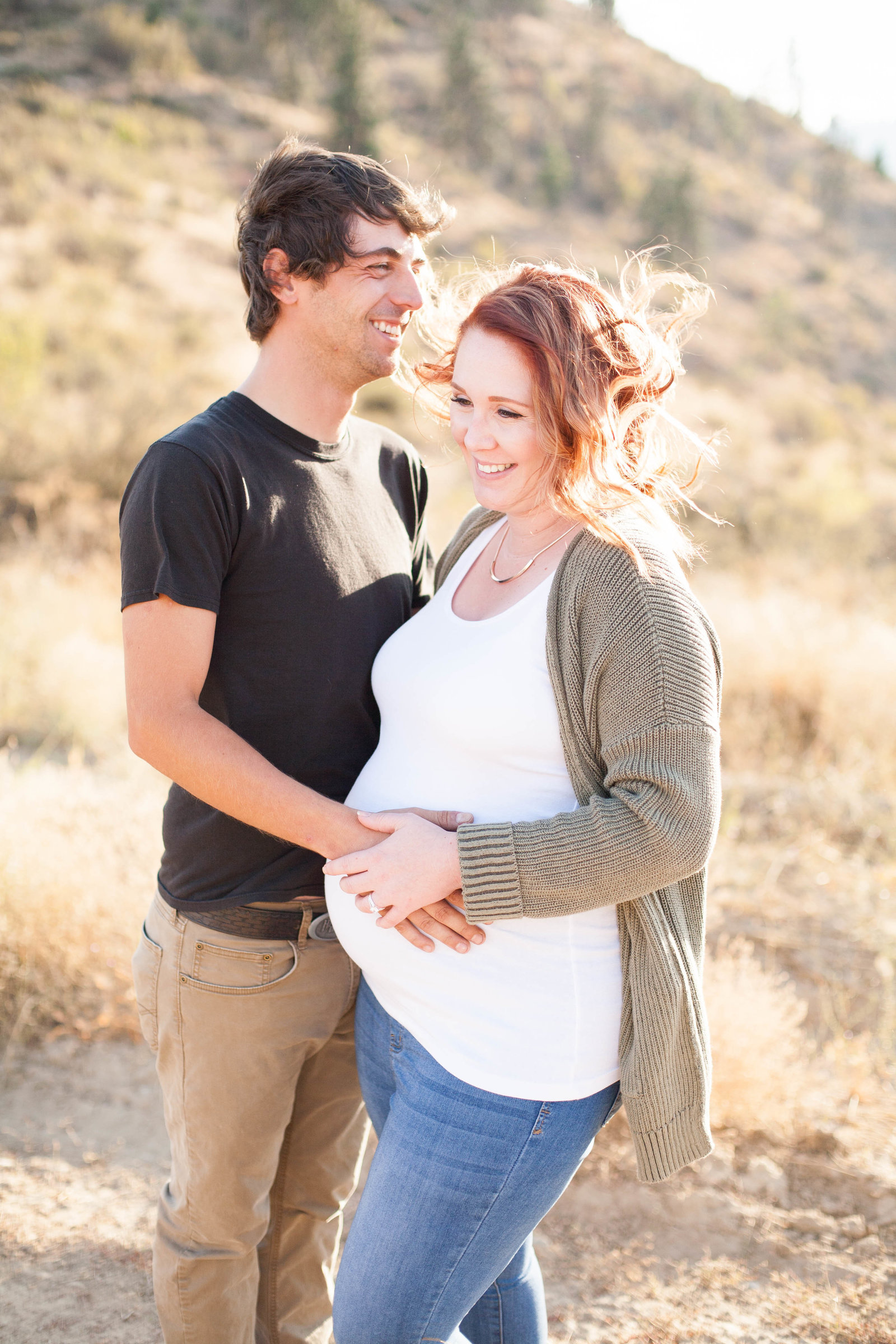 A Wenatchee maternity photoshoot featuring a man and woman embracing.