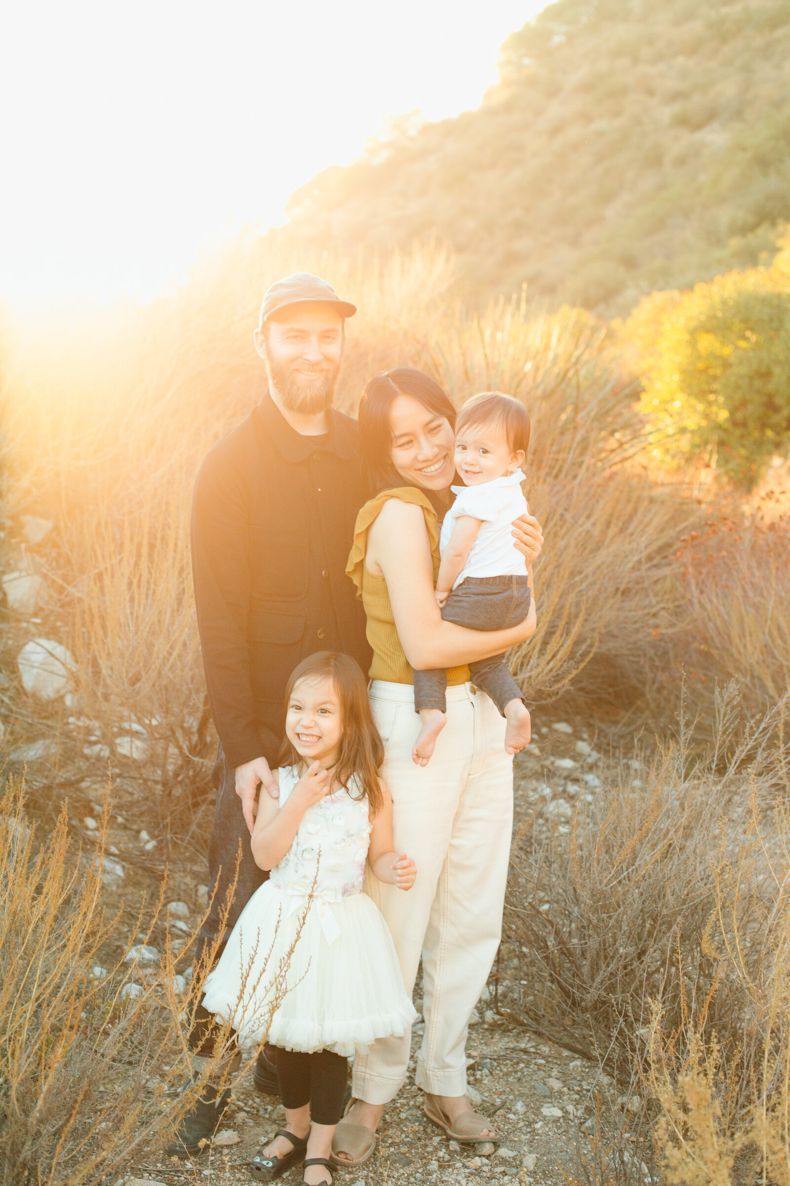 A family poses for photos in a forest in Los Angeles, Ca.