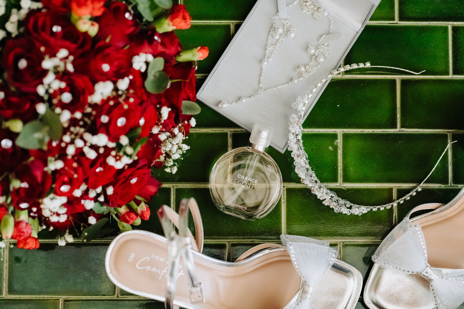 A shot of the brides shoes, flowers, jewellery and perfume taken at  Merewood Country House Hotel by Wedding Photographer Anthony Horseman