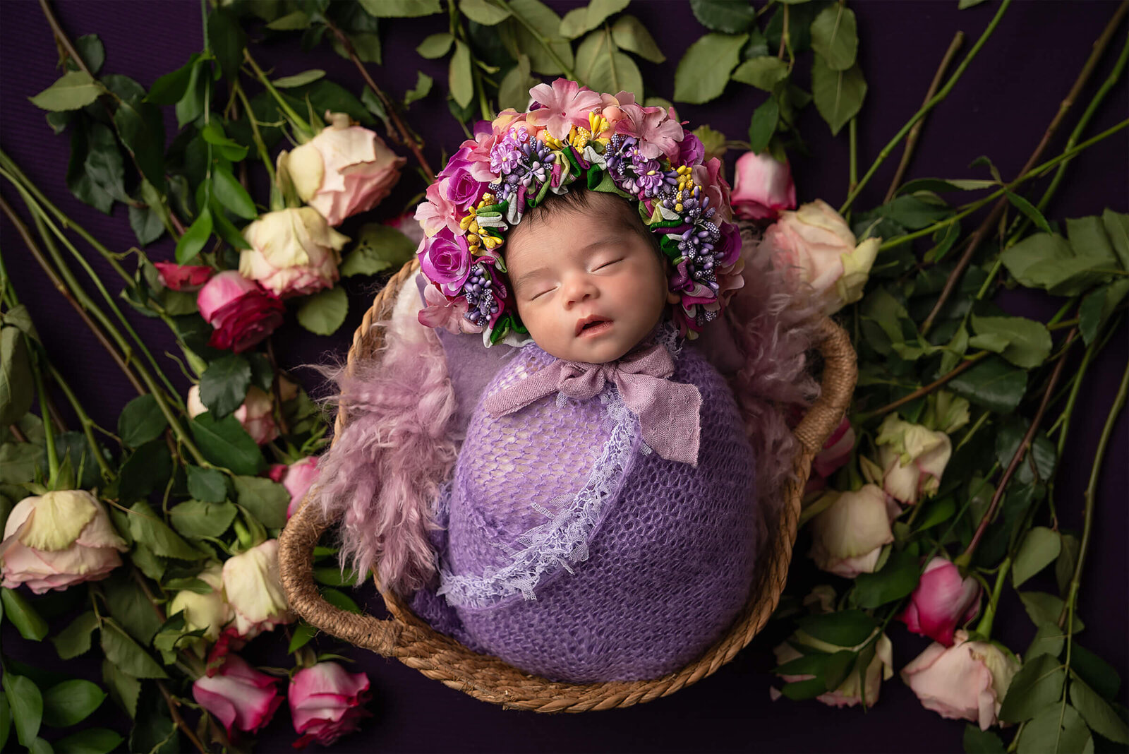 Newborn laying in flowers
