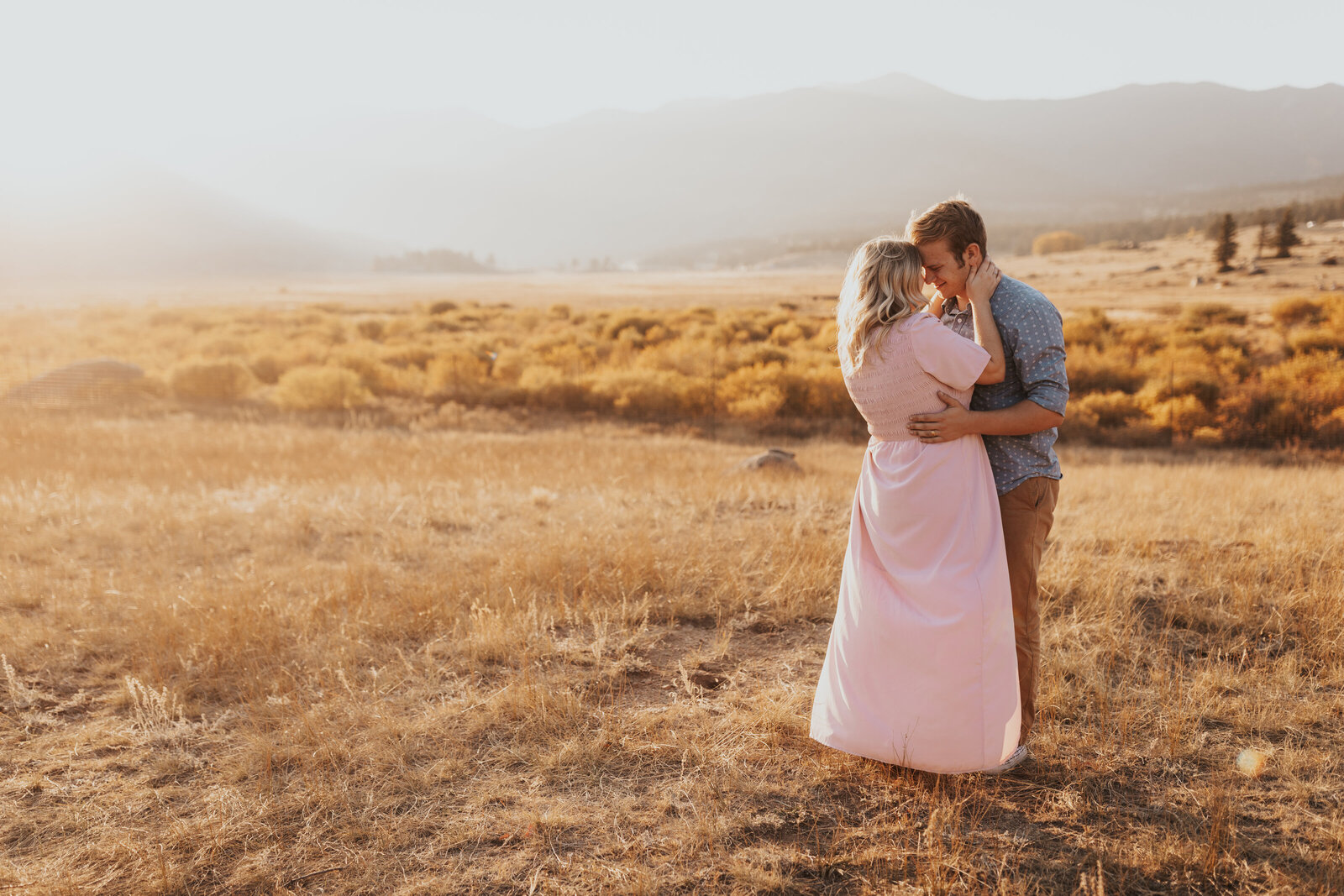 couple embraces during the sunset in Rocky Mountain National Park