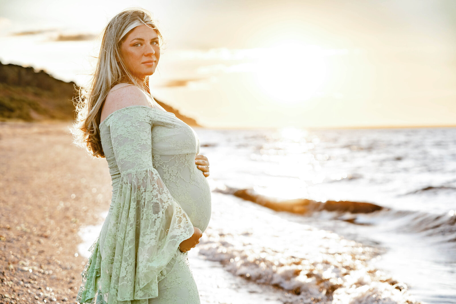 Golden Hour Maternity Session at the beach in Sunken Meadow. Mommy to be with a lace mint Green Maternity Dress.