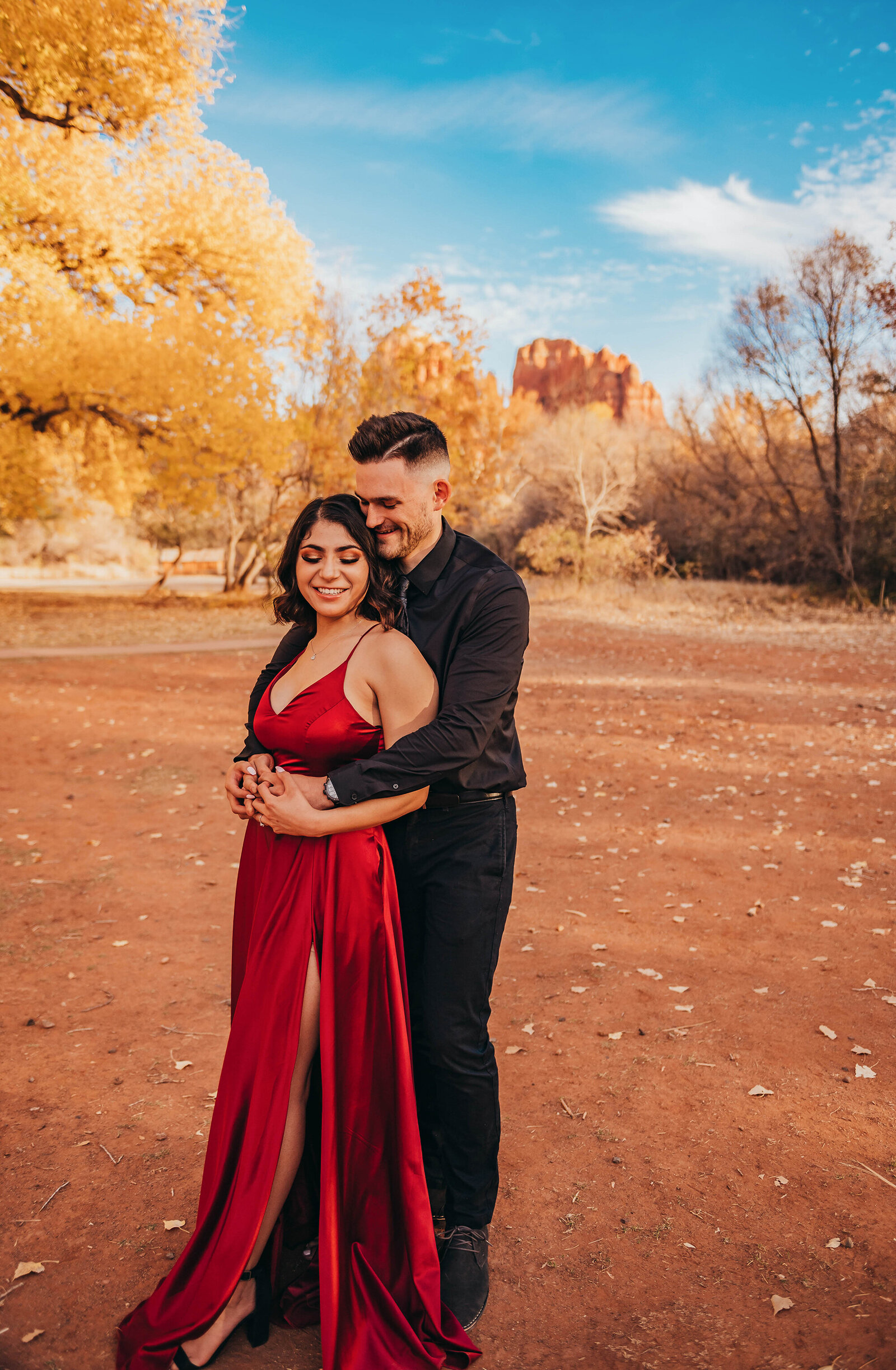 Engaged couple poses for Engagement Photos at Crescent Moon Ranch in Sedona Arizona.