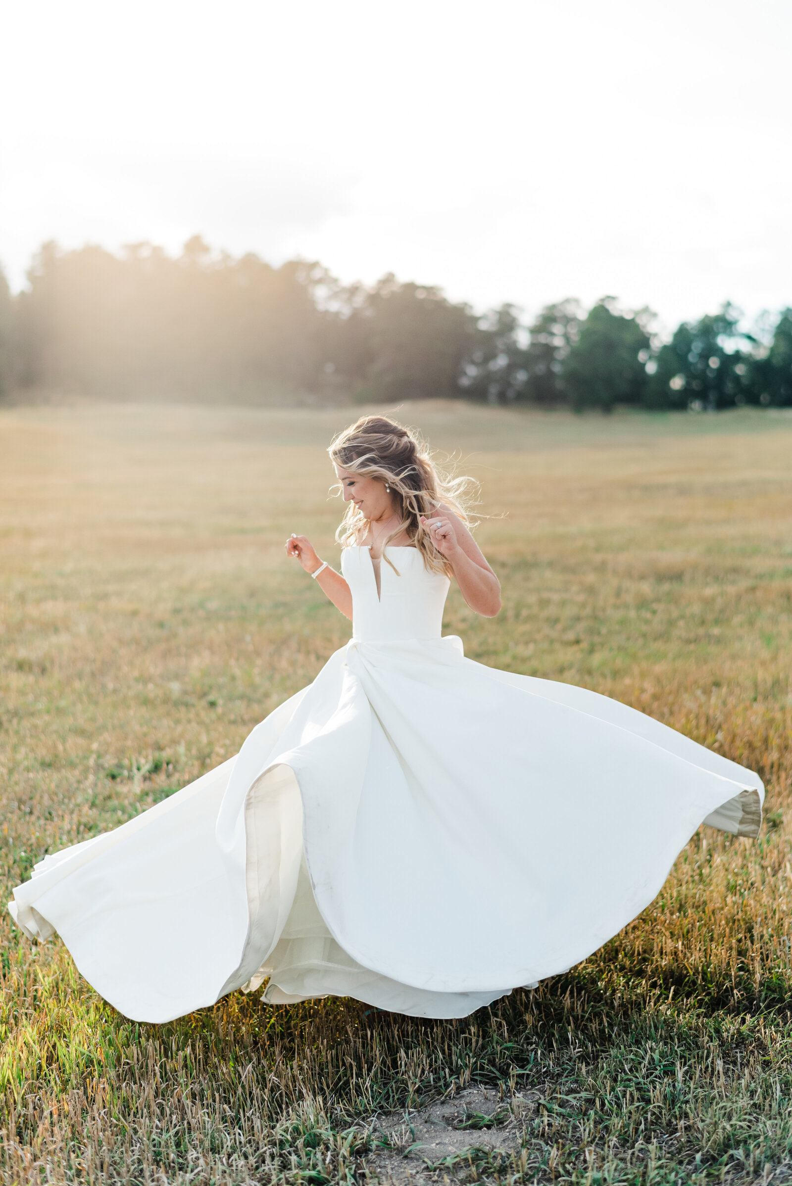 Bride spinning in big white dress