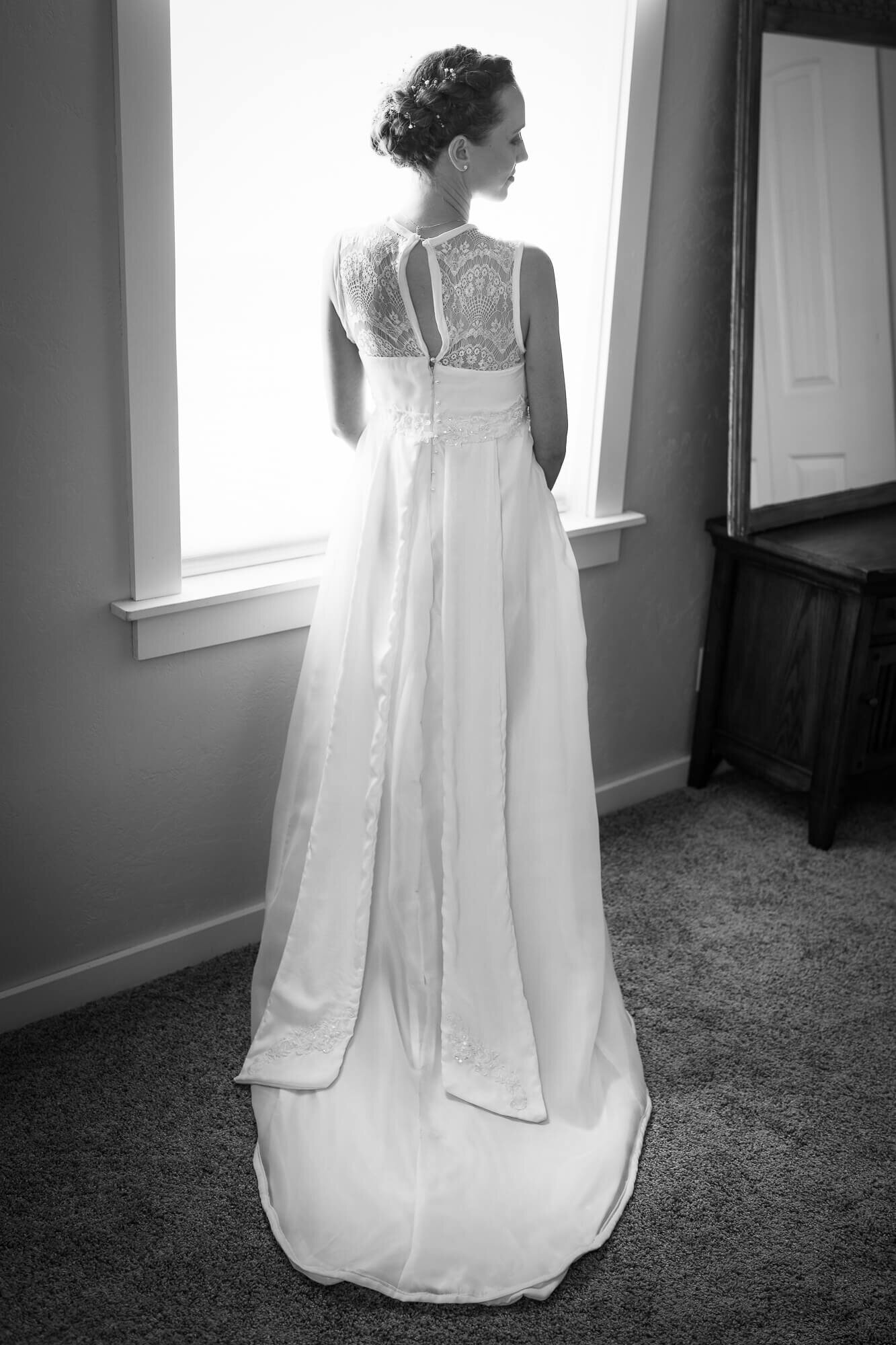 Bridal Portrait standing in front of a window