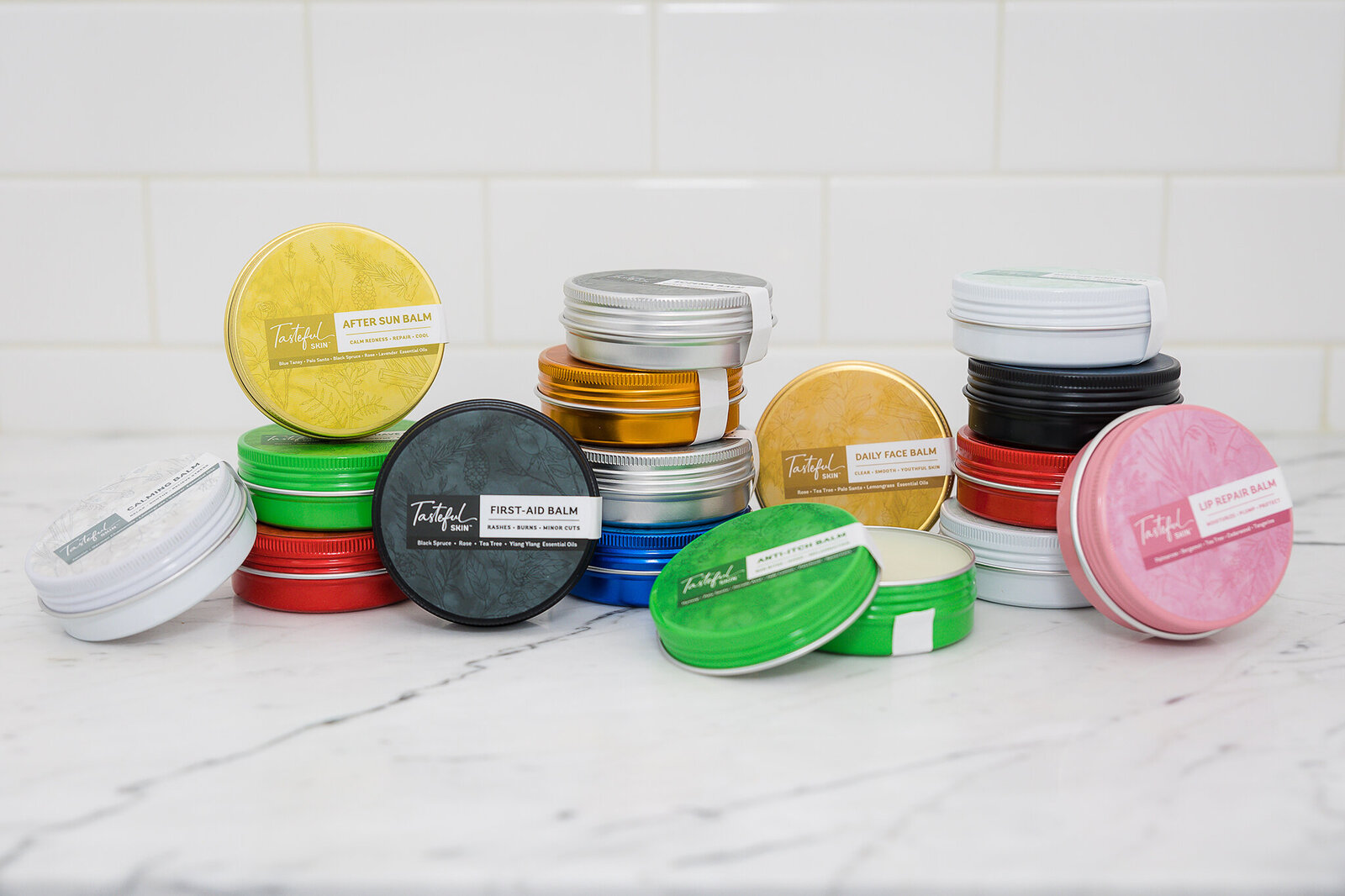 styled beauty products in colorful tins