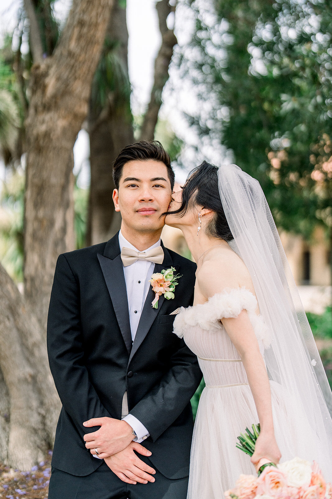 The bride and groom share a happy moment at their elegant wedding reception held at Filoli Estate in Woodside, California.