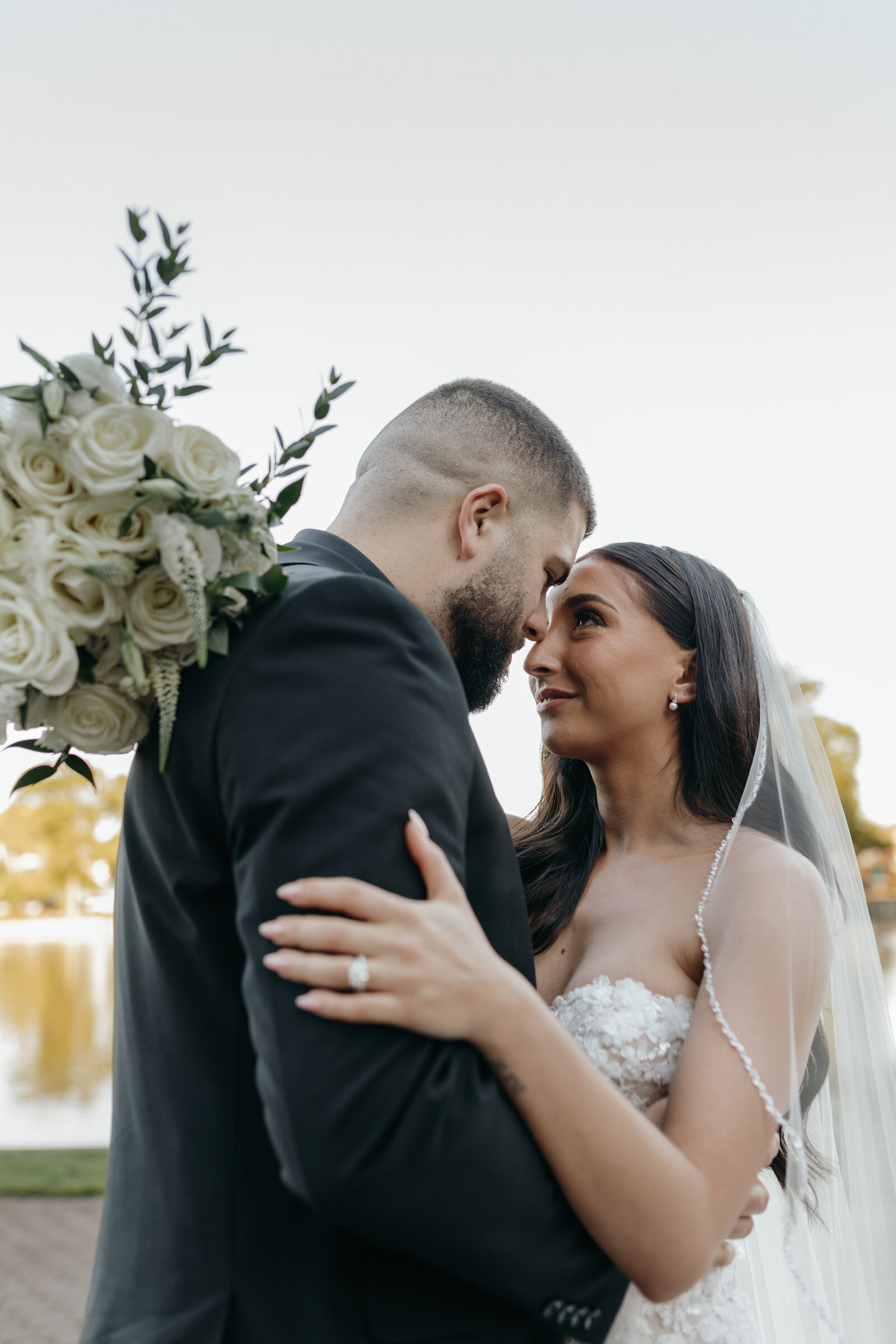 A close moment of the bride and groom at their outdoor wedding in october at a venue in Long Island, NY | Emma LeeAnn Photography