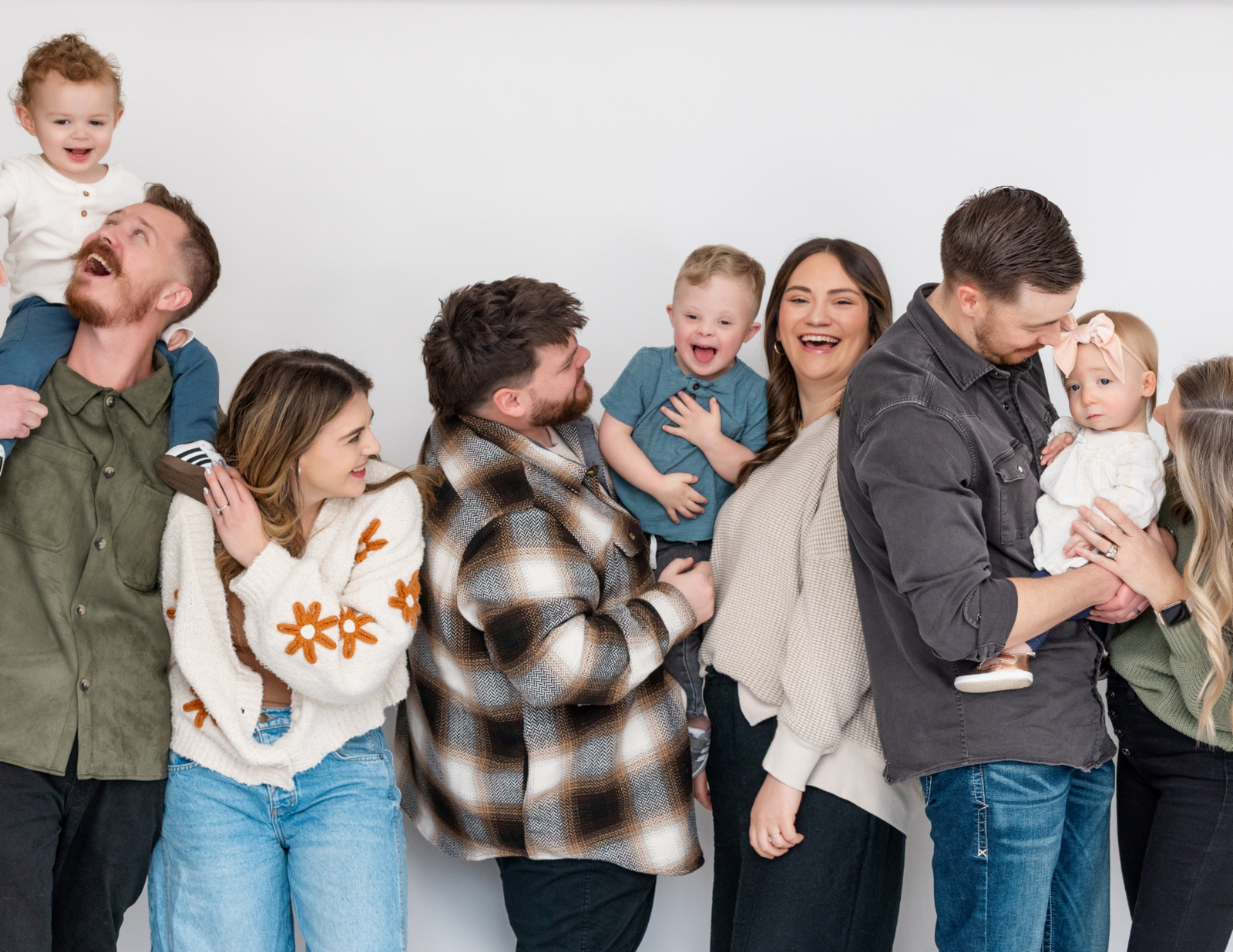 Siblings playing together, including our child with Down syndrome, fostering inclusion at home.