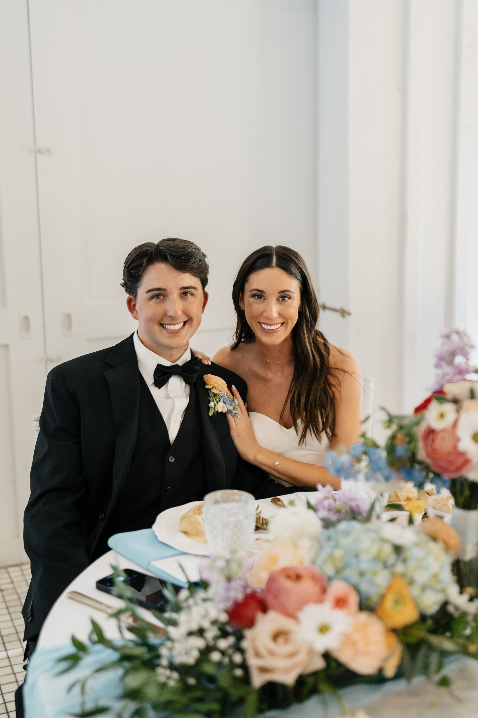 Wedding reception toast with guests, captured in a timeless style