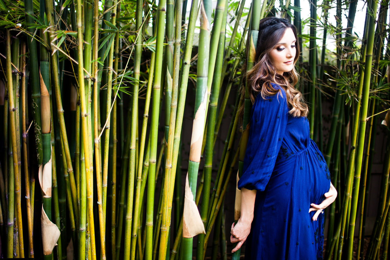 Maternity pictures in front of bamboo