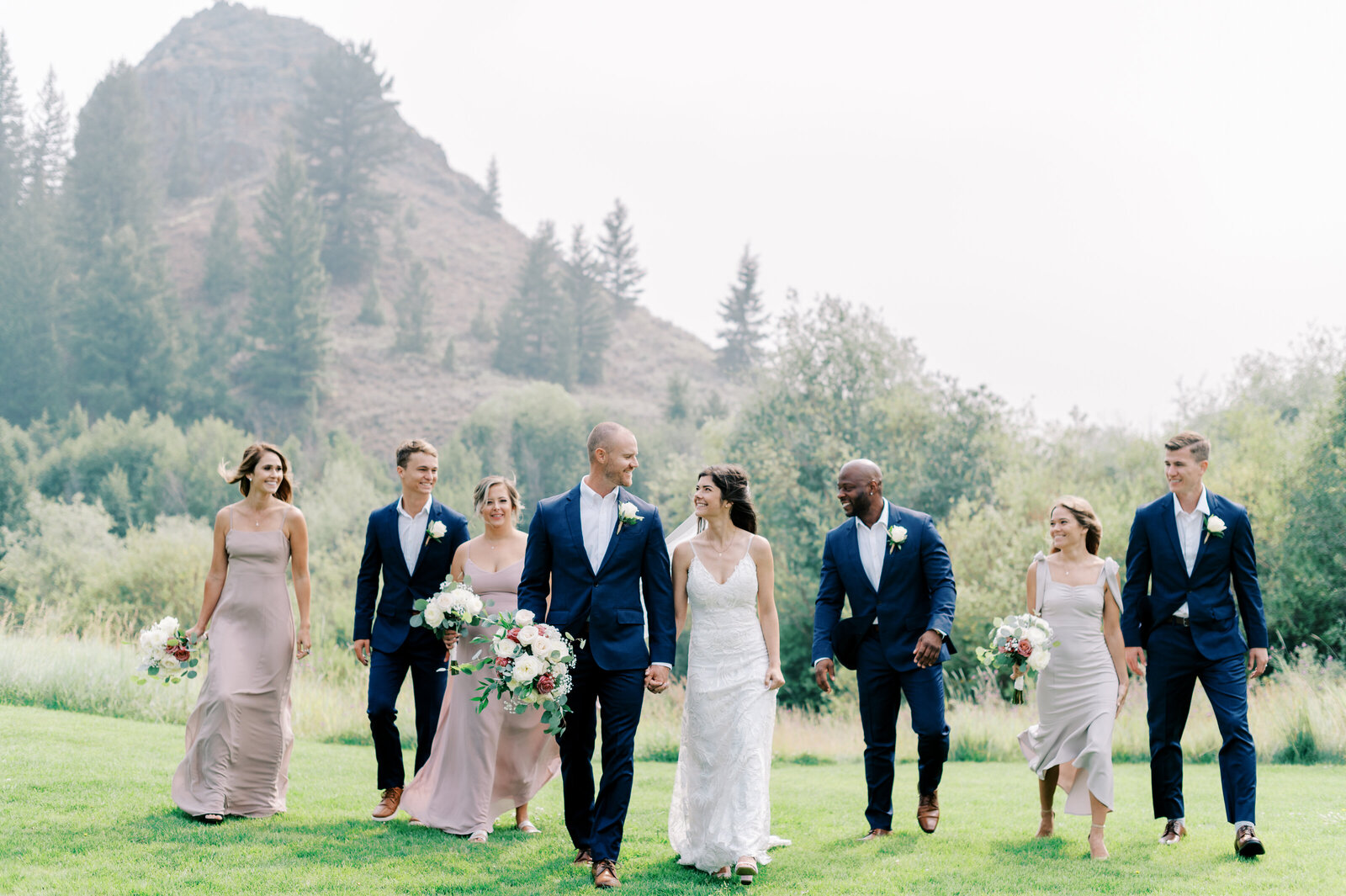 Bridal party walking at Trail Creek Cabin Wedding taken by the Best Sun Valley Wedding Photographers