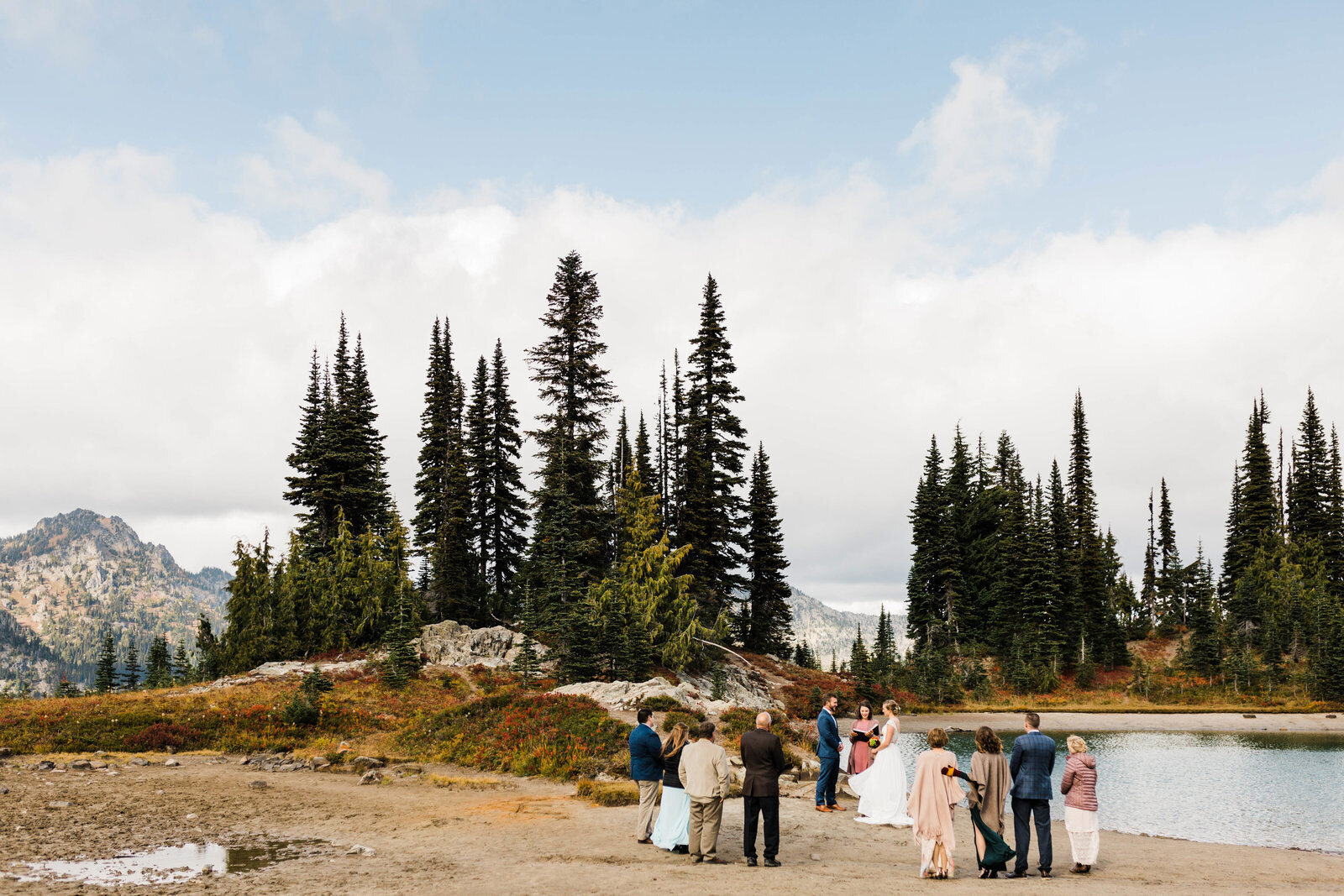 A couple says their vows at a small backcountry lake along the Pacific Crest Trail near Mt Rainier National Park