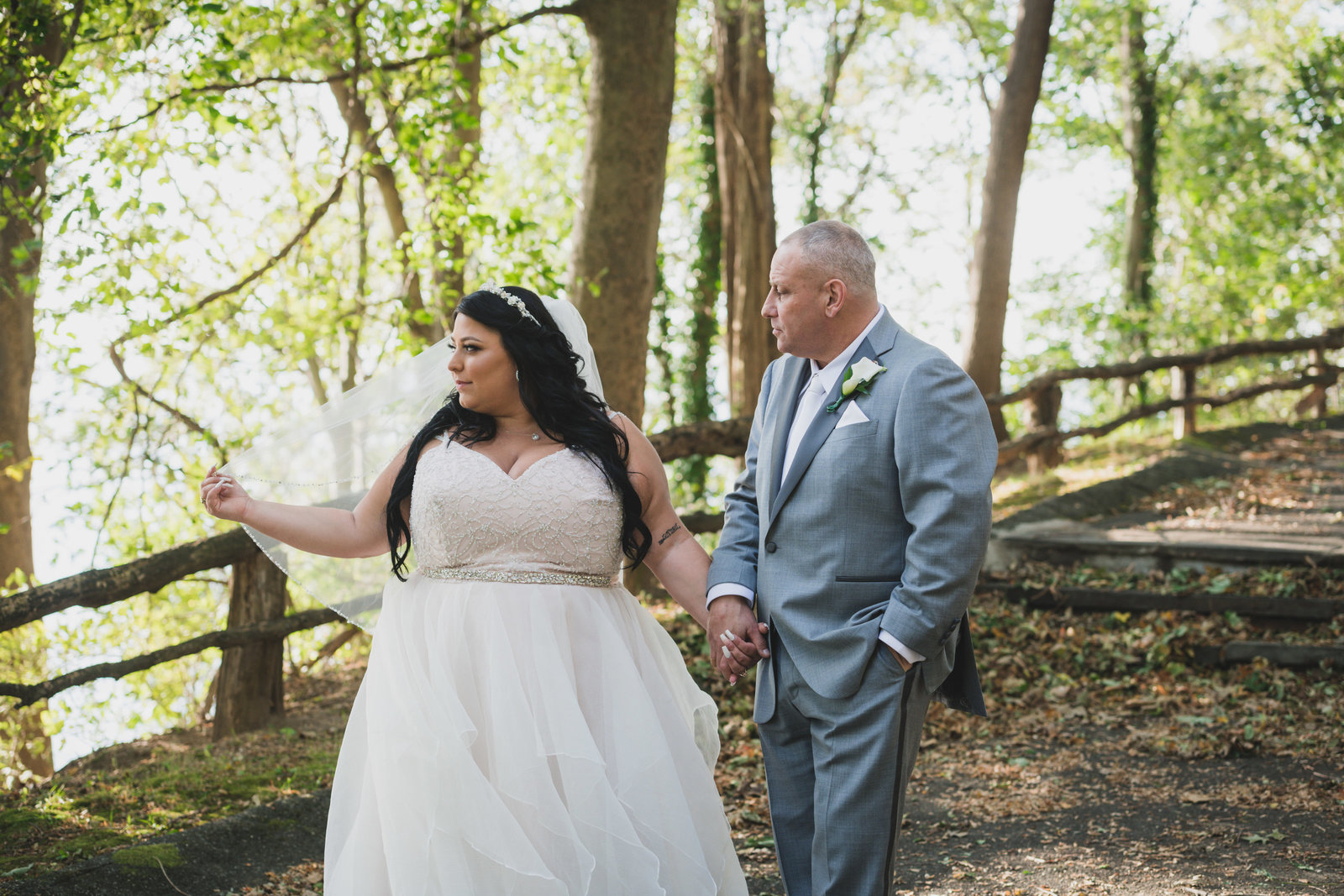 photo of bride and groom walking through gardens at Sea Cliff Manor