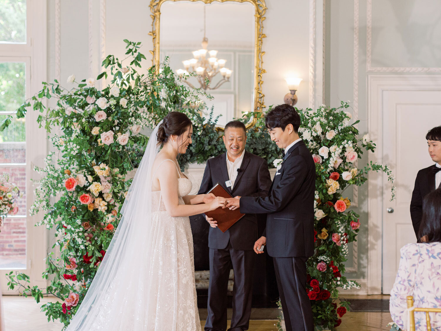 Wedding ceremony with bride and groom exchanging vows indoors