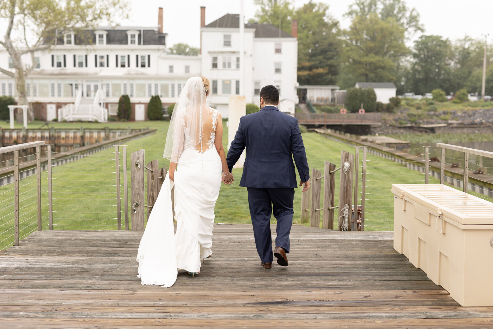 bride and groom walking away back to venue
