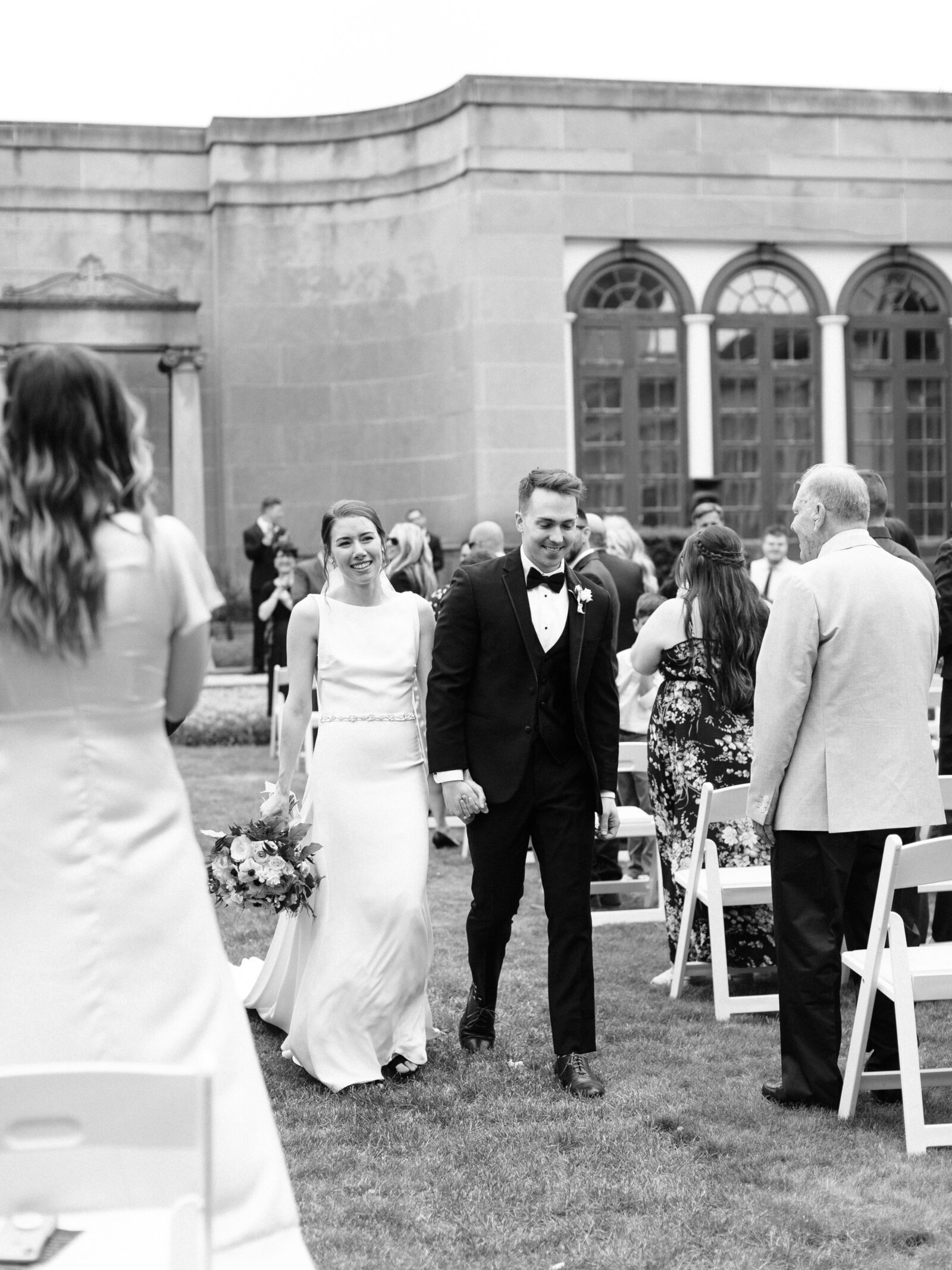 bride and groom walking down aisle at cleveland historical society wedding