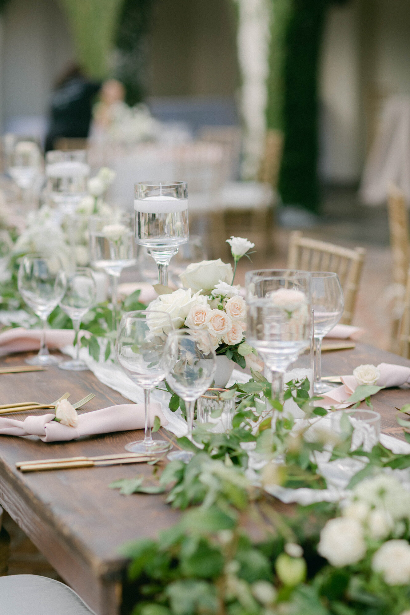 luxury tablescape design with glasses and greenery