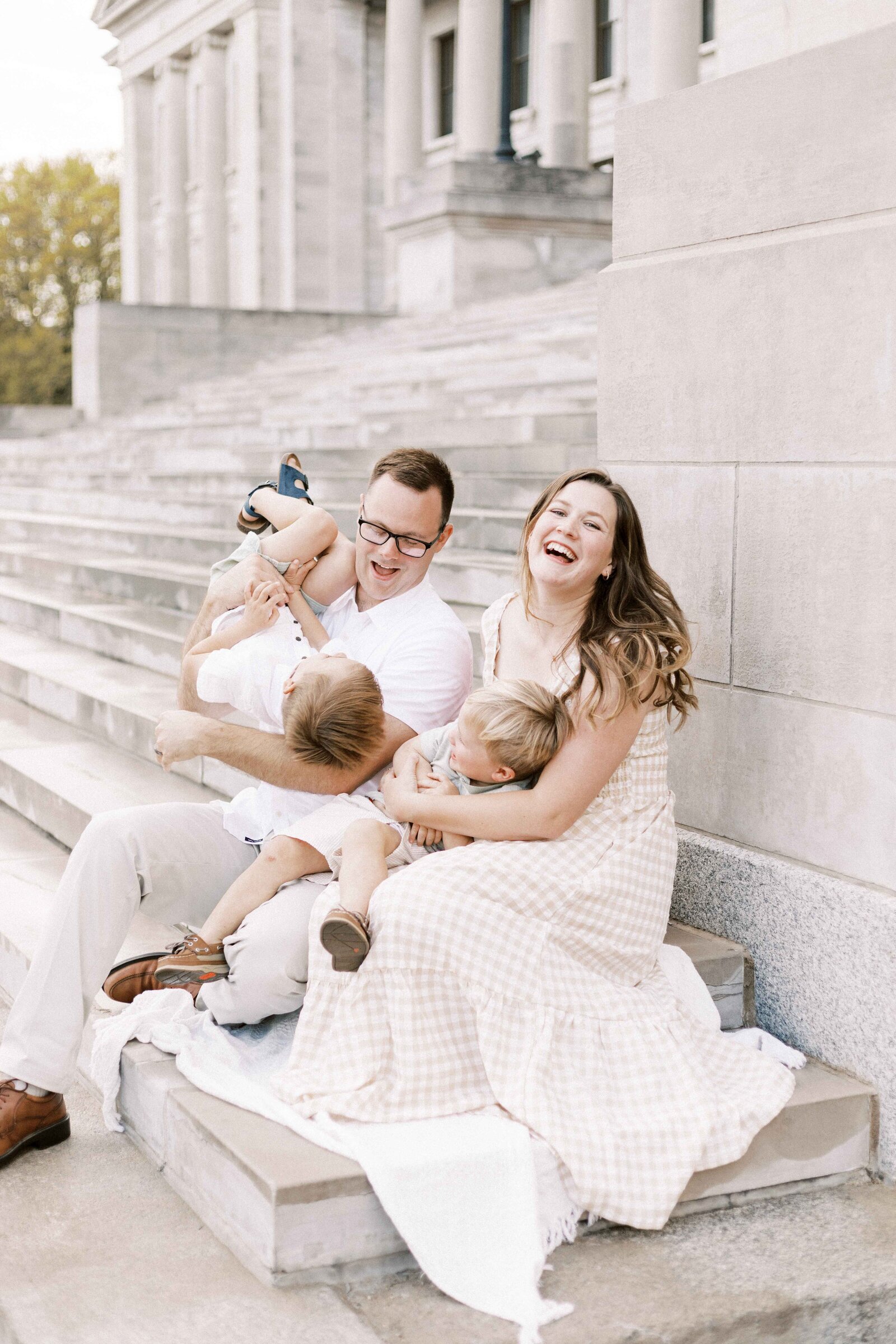 family laughing and playing during peoria illinois photos 