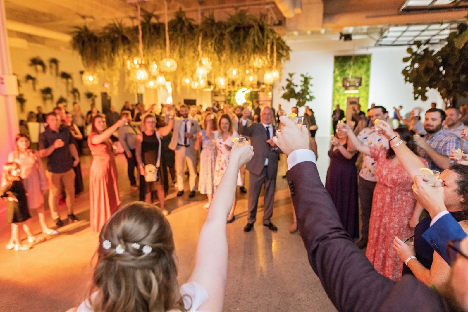 bride-groom-cheers-toast-with-guests