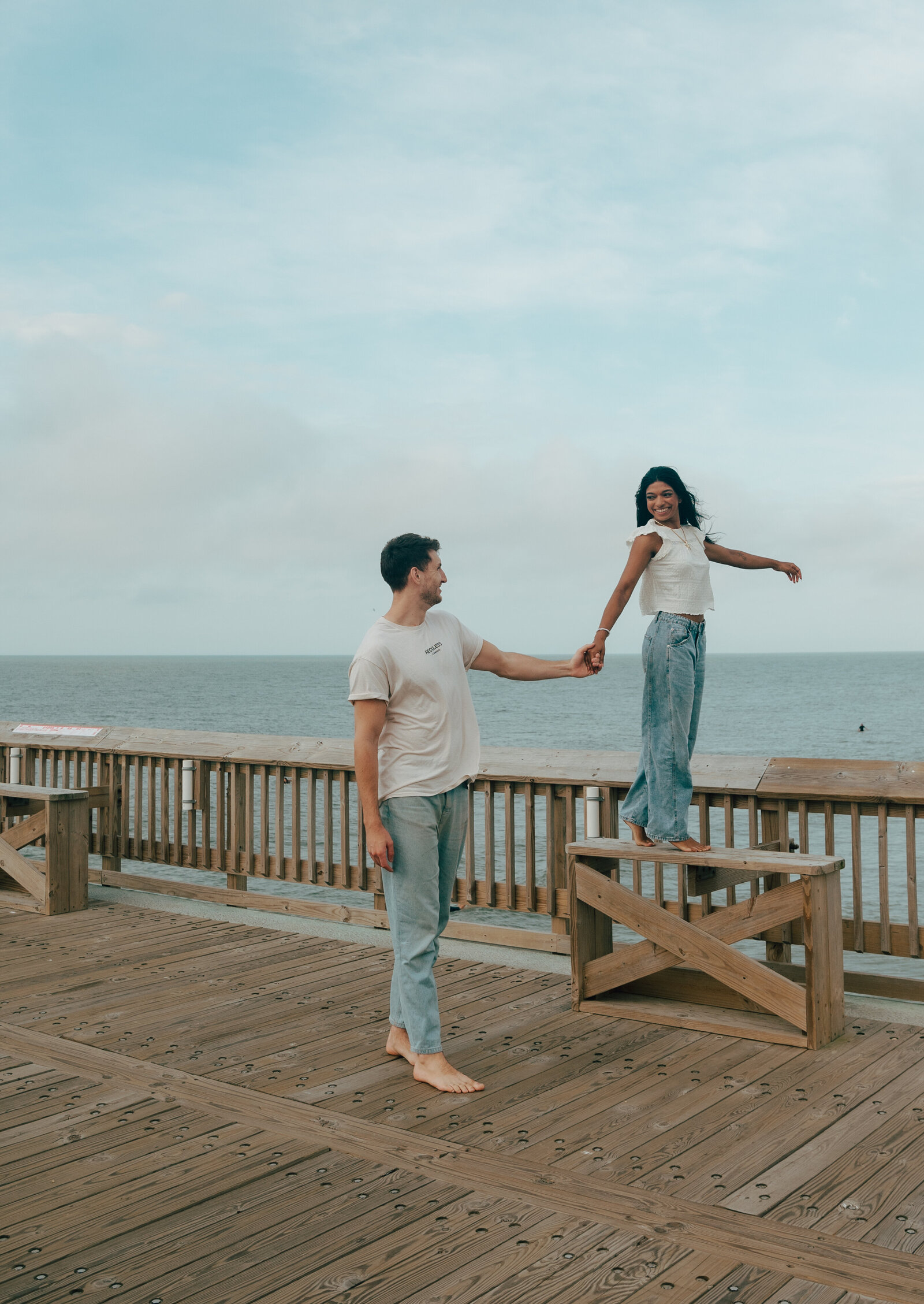 couple on pier at Folly Beach SC digital and film photographer