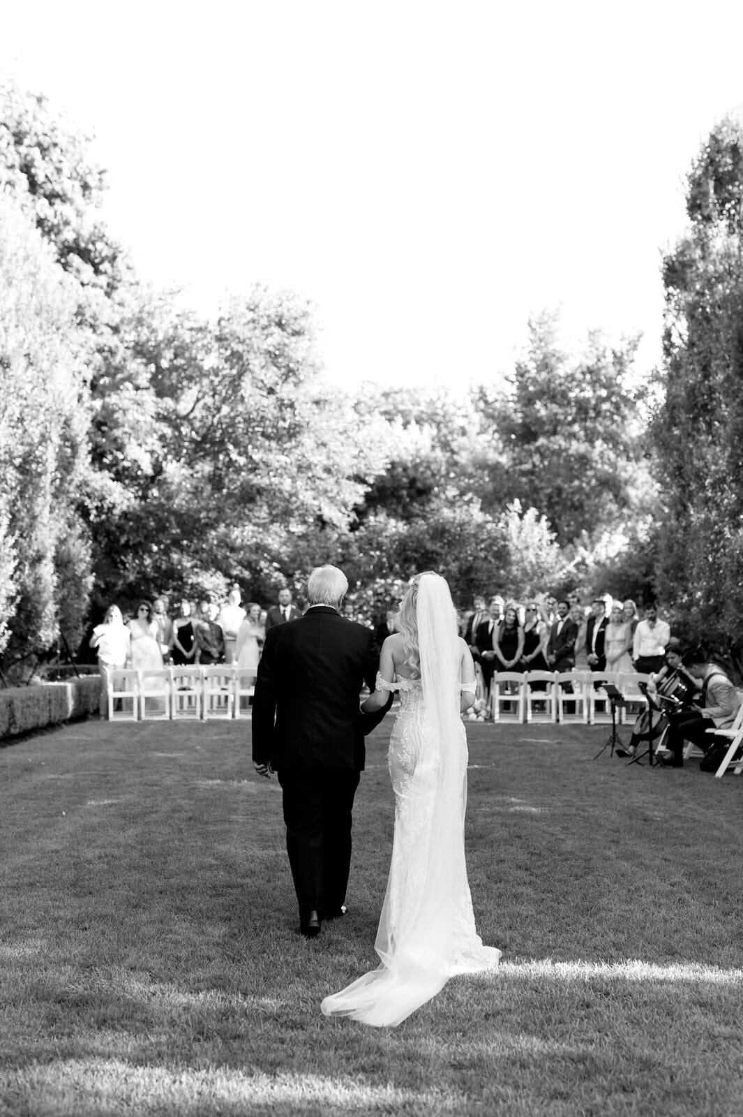 Bride Enters Ceremony Dramatic Entrance at Graydon Hall Manor Toronto Wedding Photographer Jacqueline James Photography