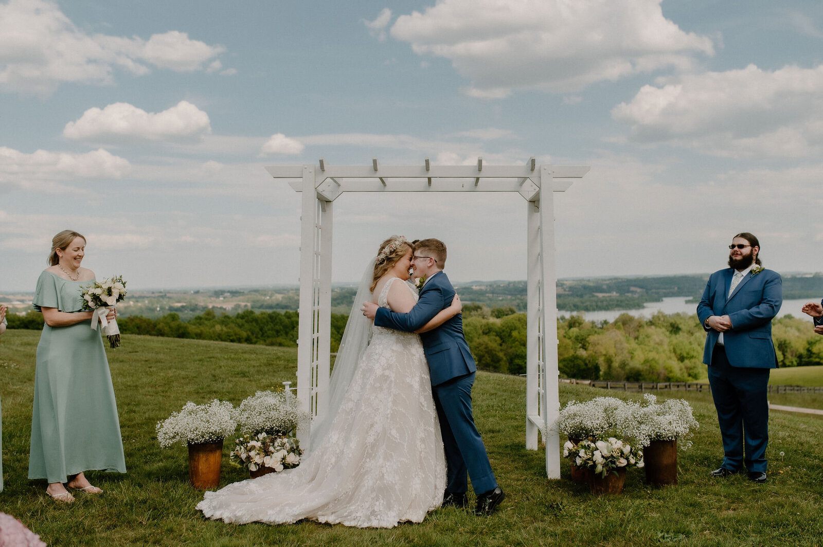 joyful couple embracing during outdoor wedding ceremony at Lauxmont Farms