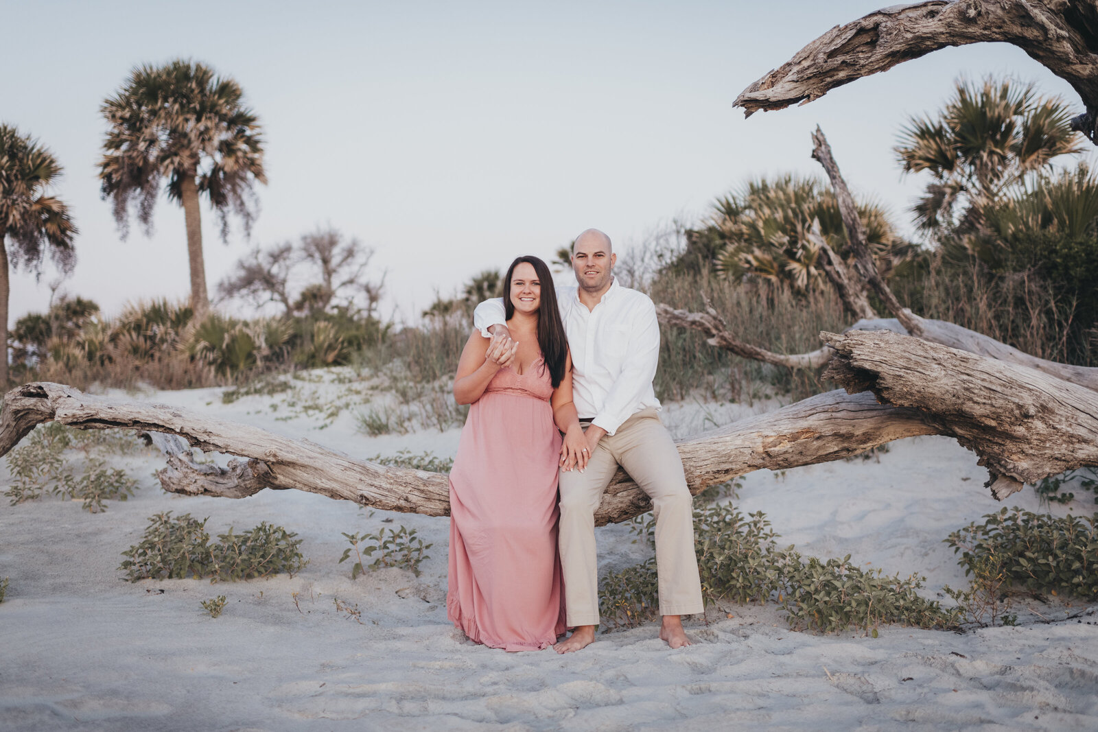 couples on hilton head beach with driftwood