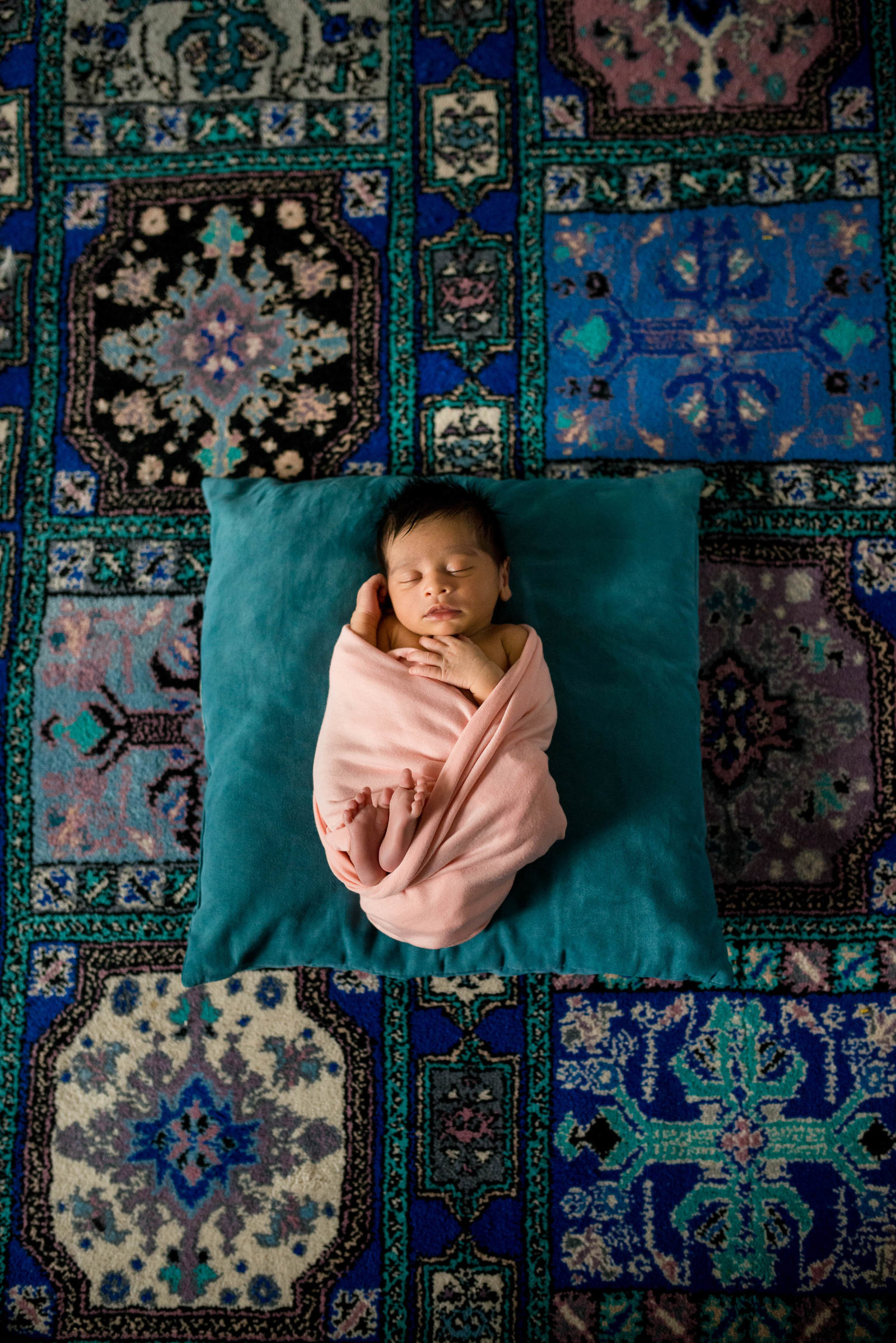 Newborn posed at home on furniture in lifestyle session Boston