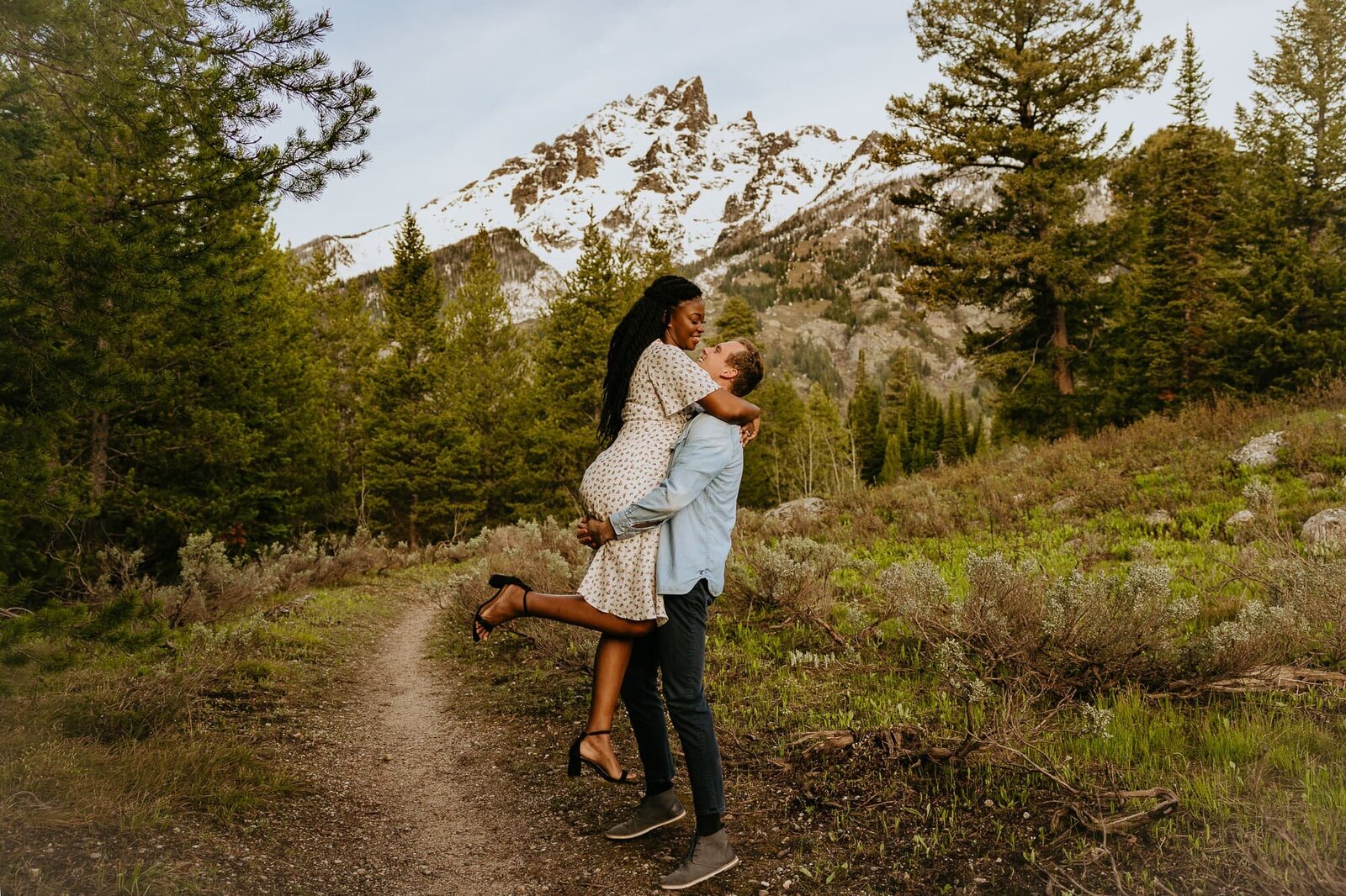A couple hugging during their Grand Teton National Park engagement photo session