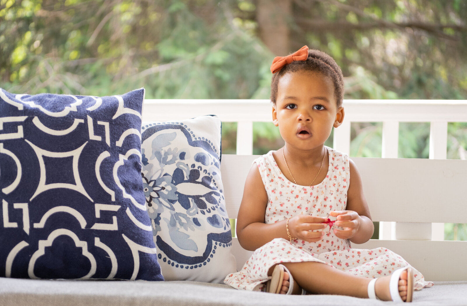 Toddler on porch swing