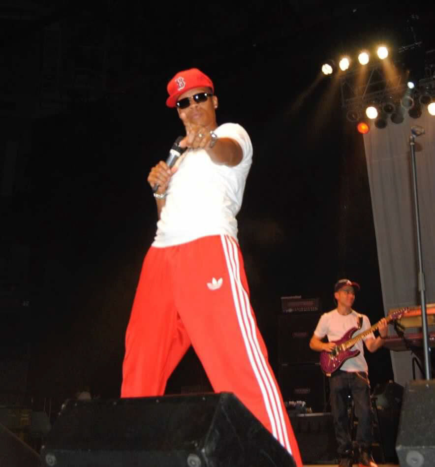 Ronnie DeVoe pointing at concert