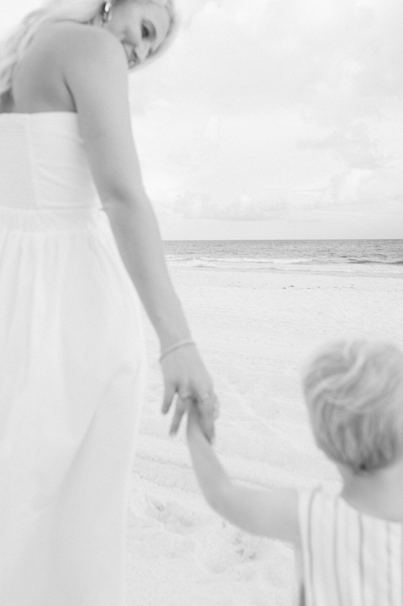 A close-up of a toddler holding his mother's hand during the family photo session with Chelsea Nichole Photography. 