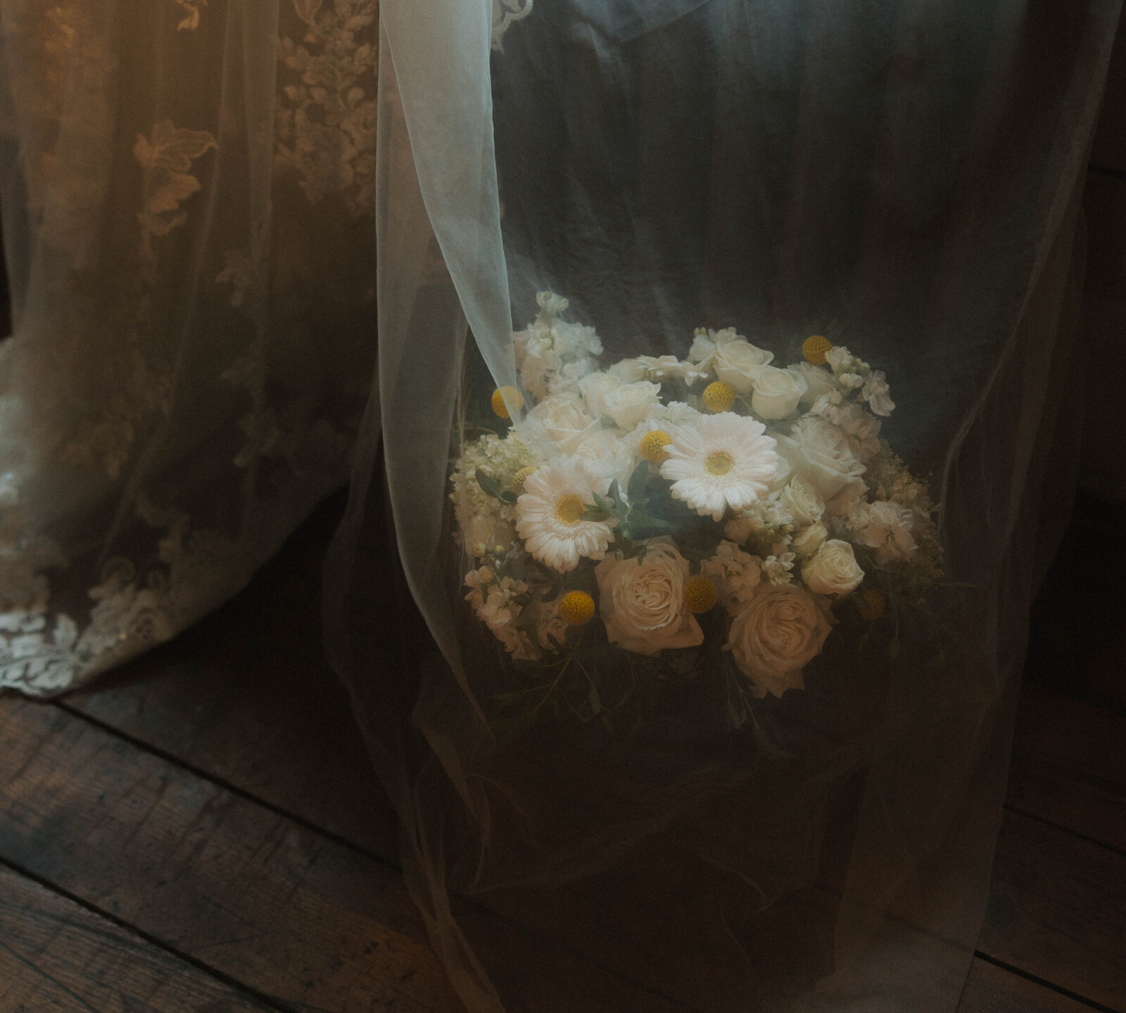 Vintage shot of a floral bouquet covered with a veil