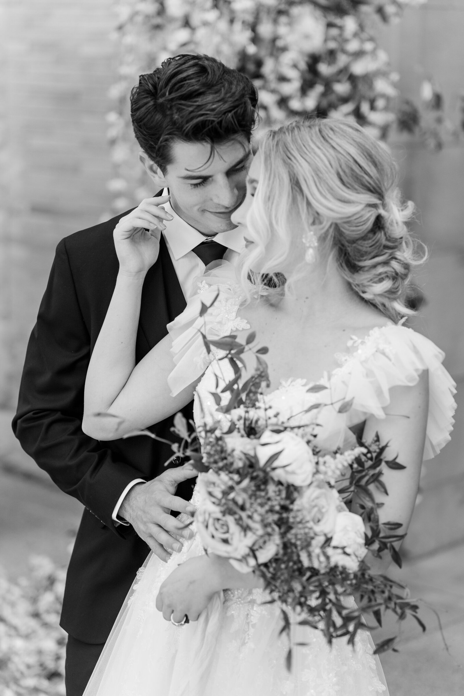 Close up portrait of bride and groom in black and white