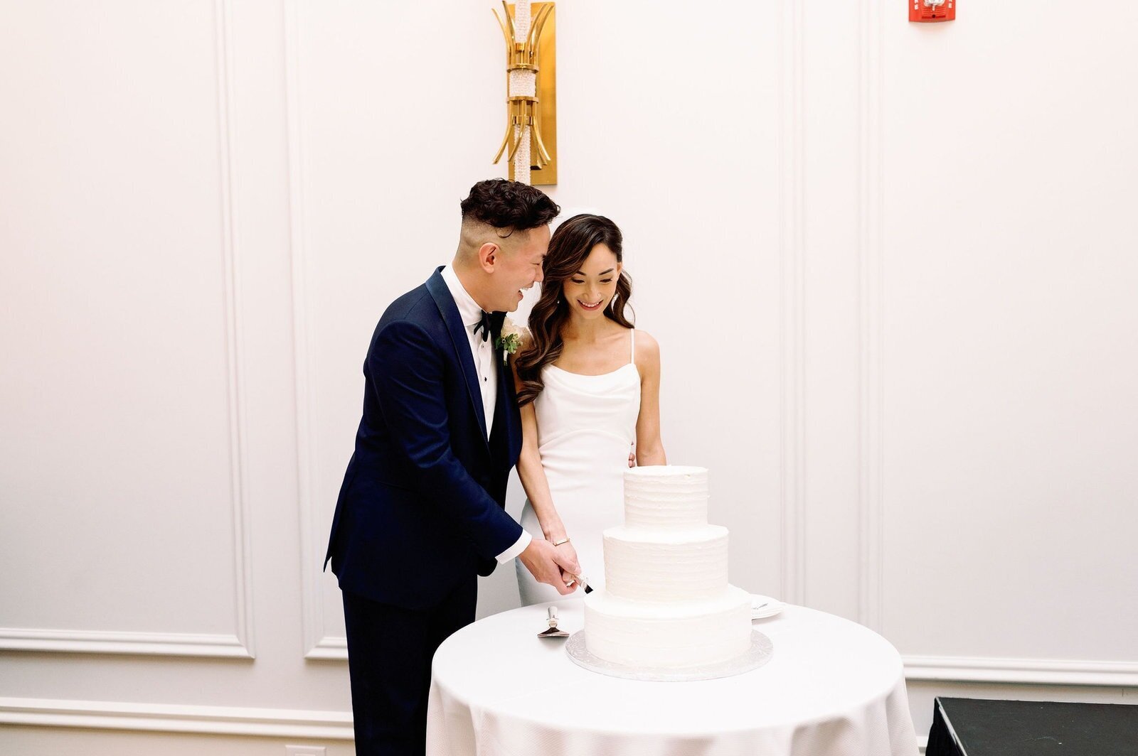 Reception Couple Cuts Wedding Cake Happiness at Arlington Estate Vaughan Toronto Wedding Venue Jacqueline james Photography