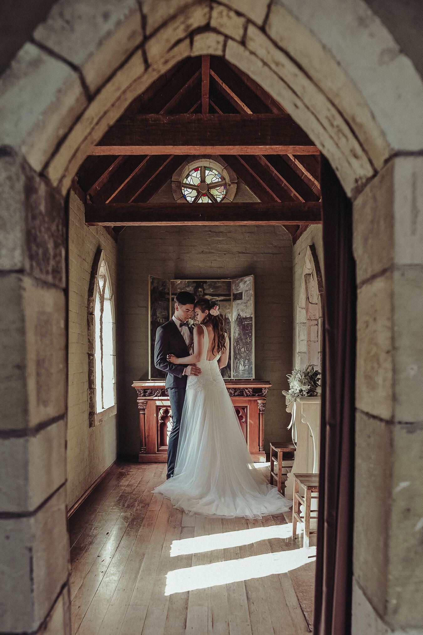 Bride and groom striking a romantic pose