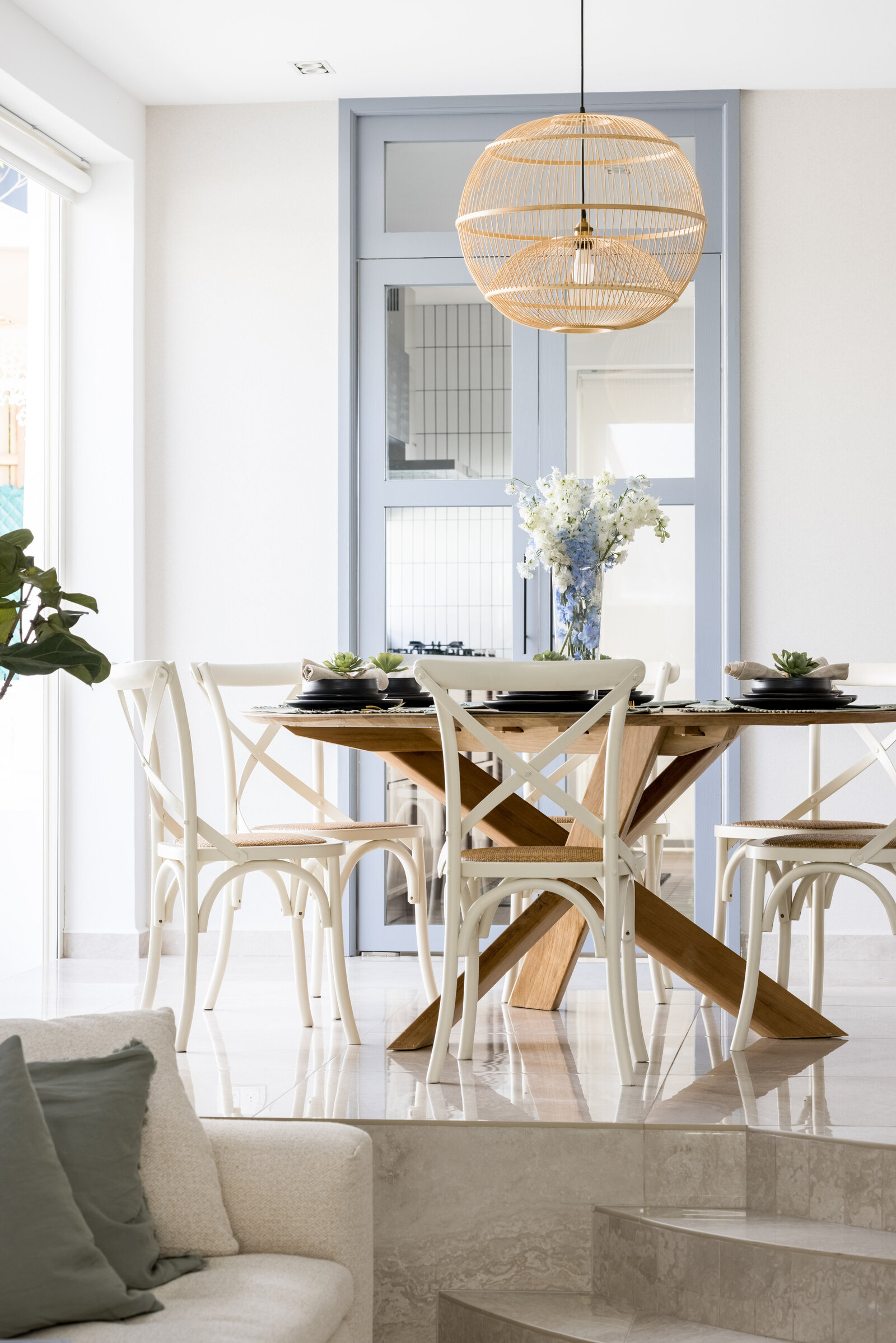 circular dining table with wooden chairs